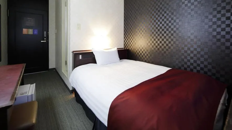 Bed in Pioland Hotel