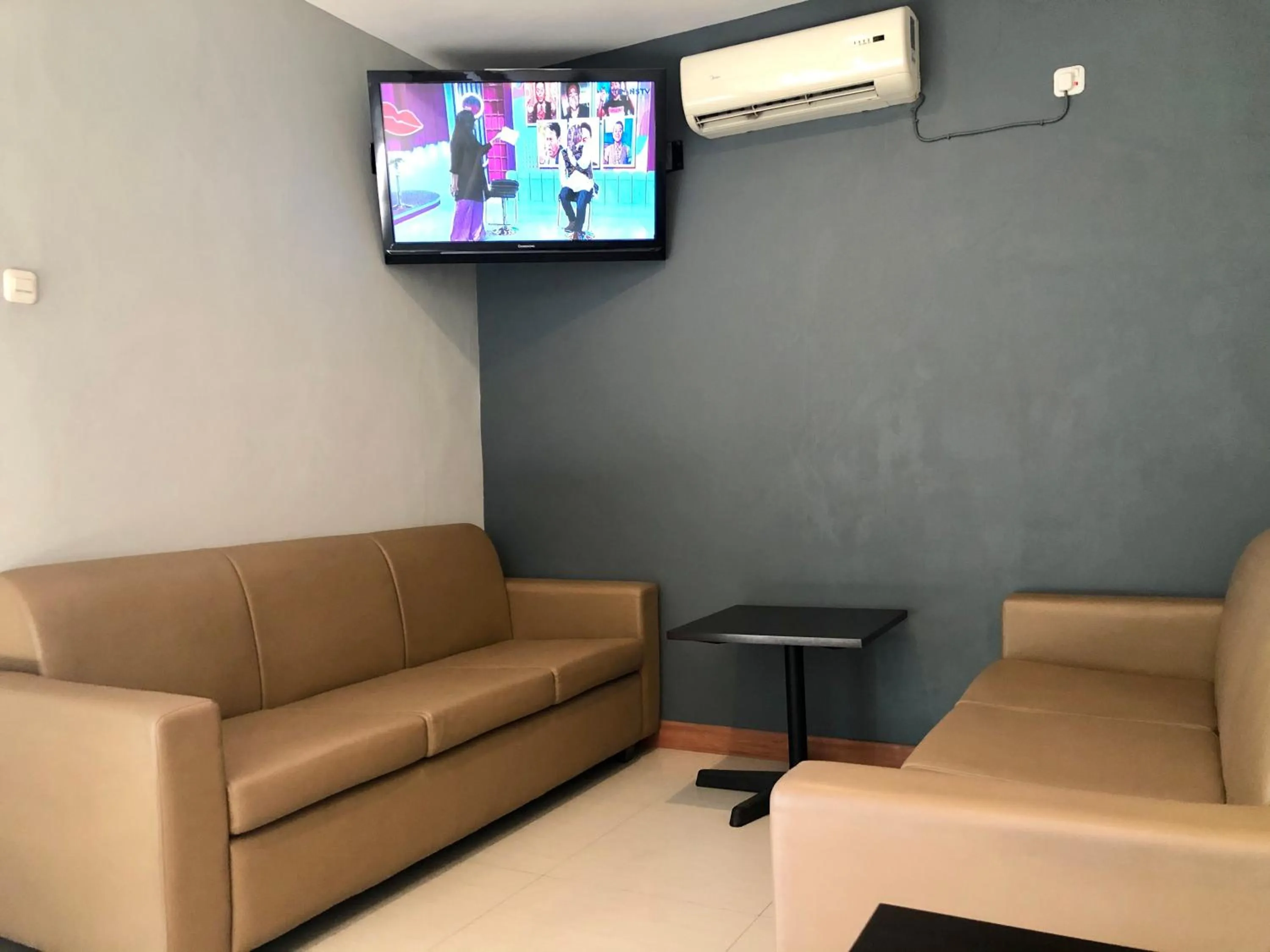 Communal lounge/ TV room in Kana Citra Guesthouse