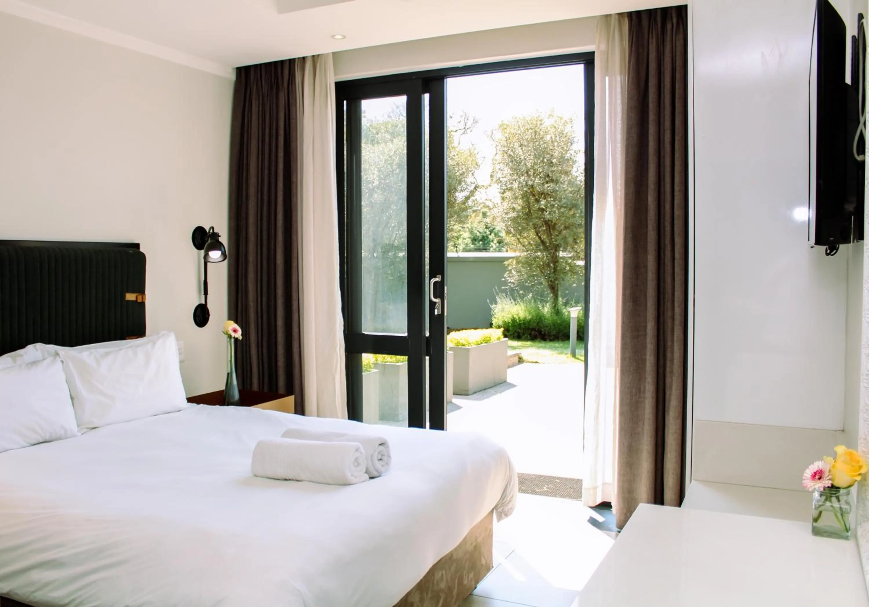 Patio, Bed in The Max Hotel Sandton