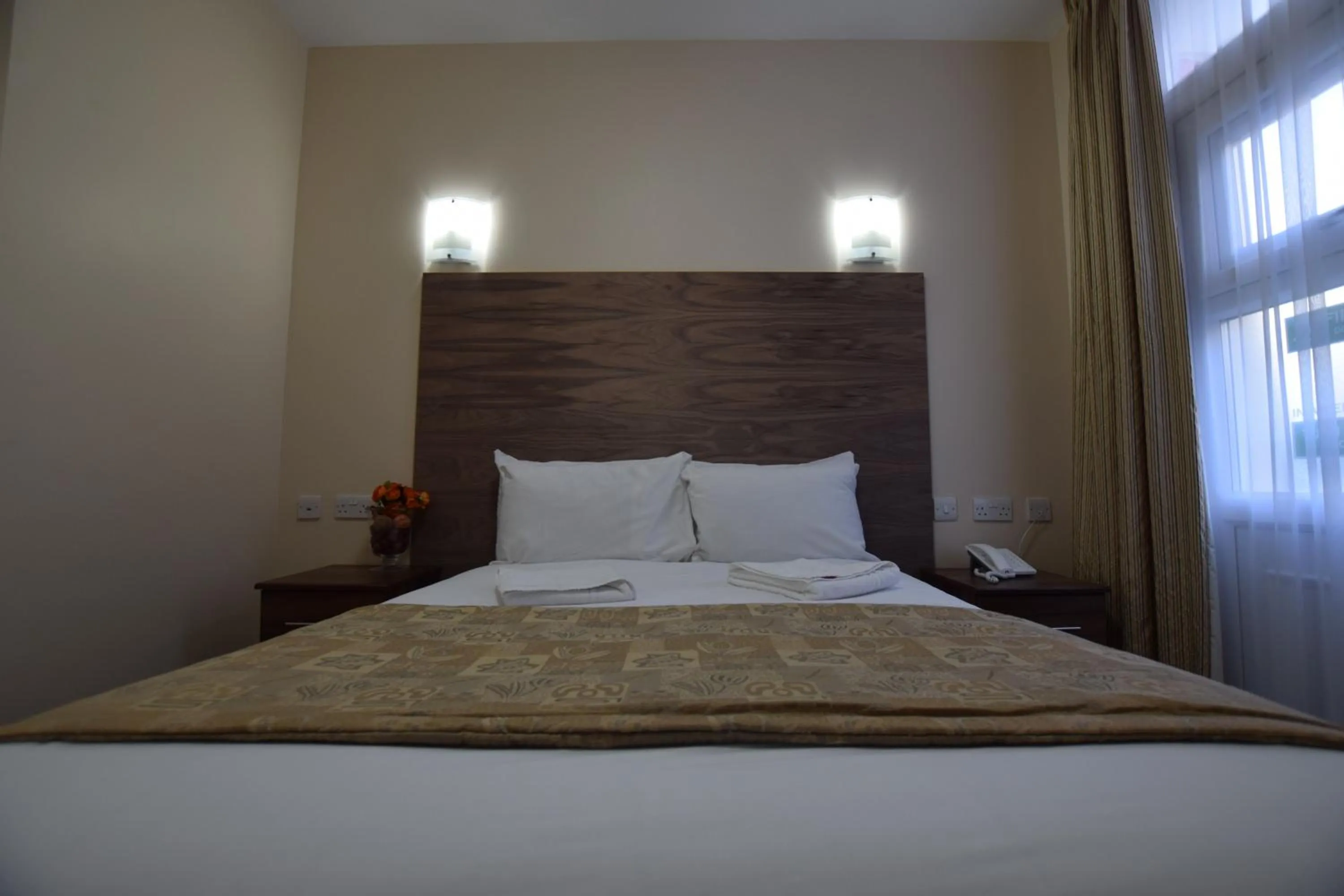 Bed in Lucky 8 Hotel