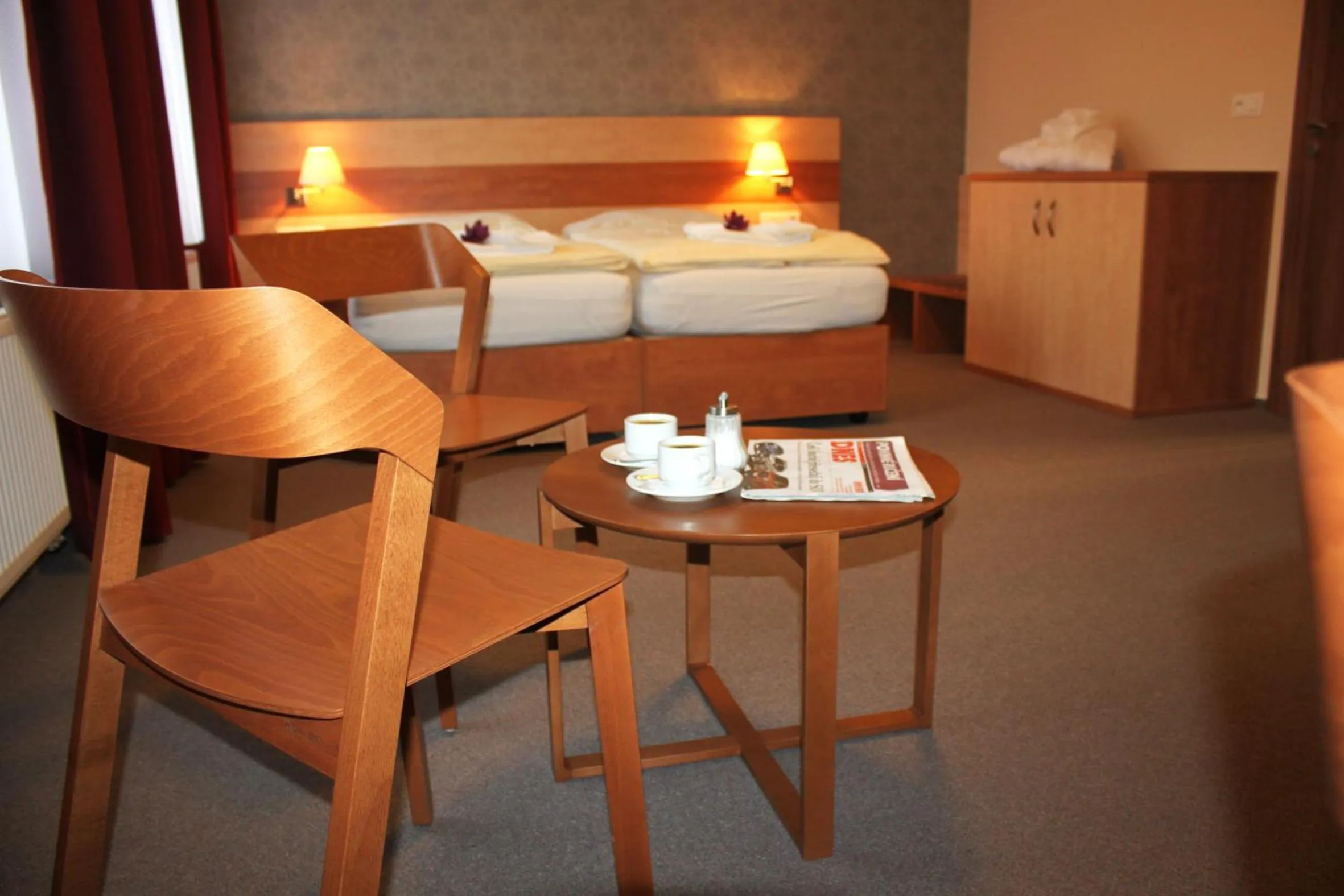 Seating area, Bed in Hotel Toč