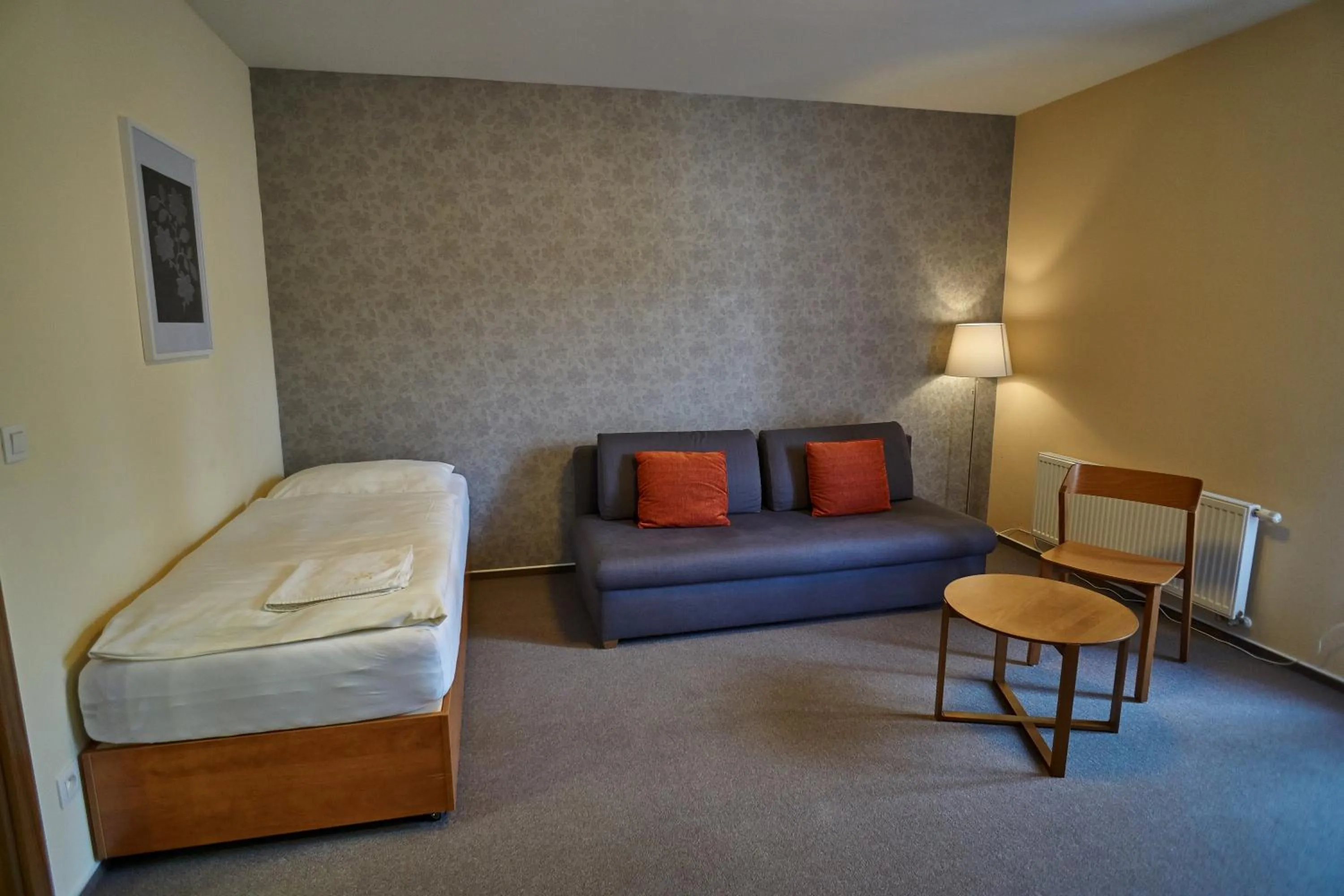 Seating area, Bed in Hotel Toč