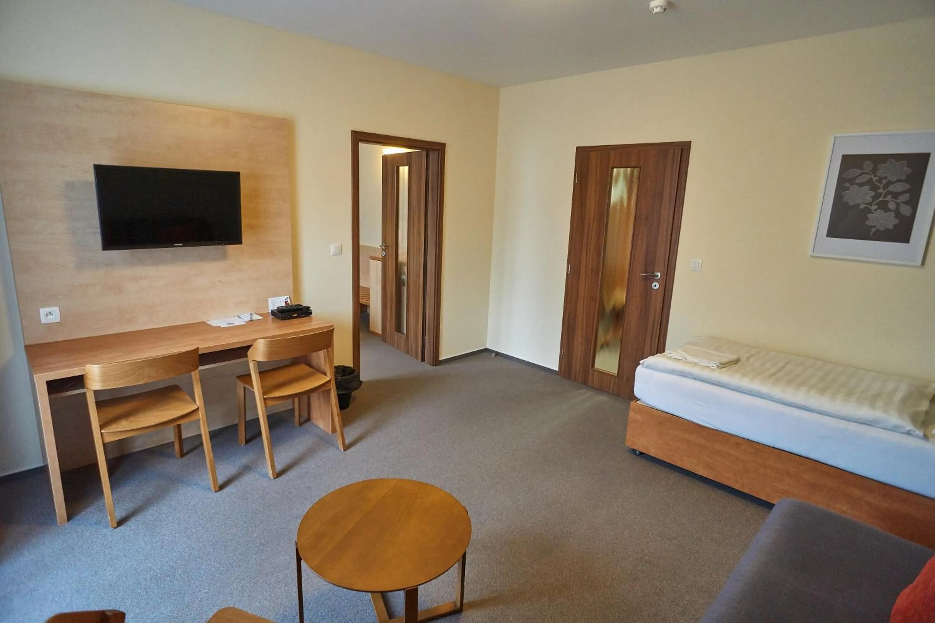 Seating area, Bed in Hotel Toč