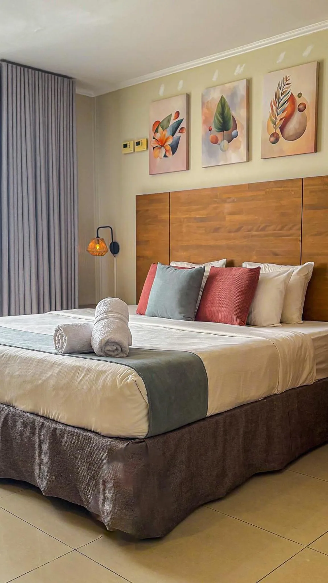 Bed in Majestic City Suites & Beach Hotel