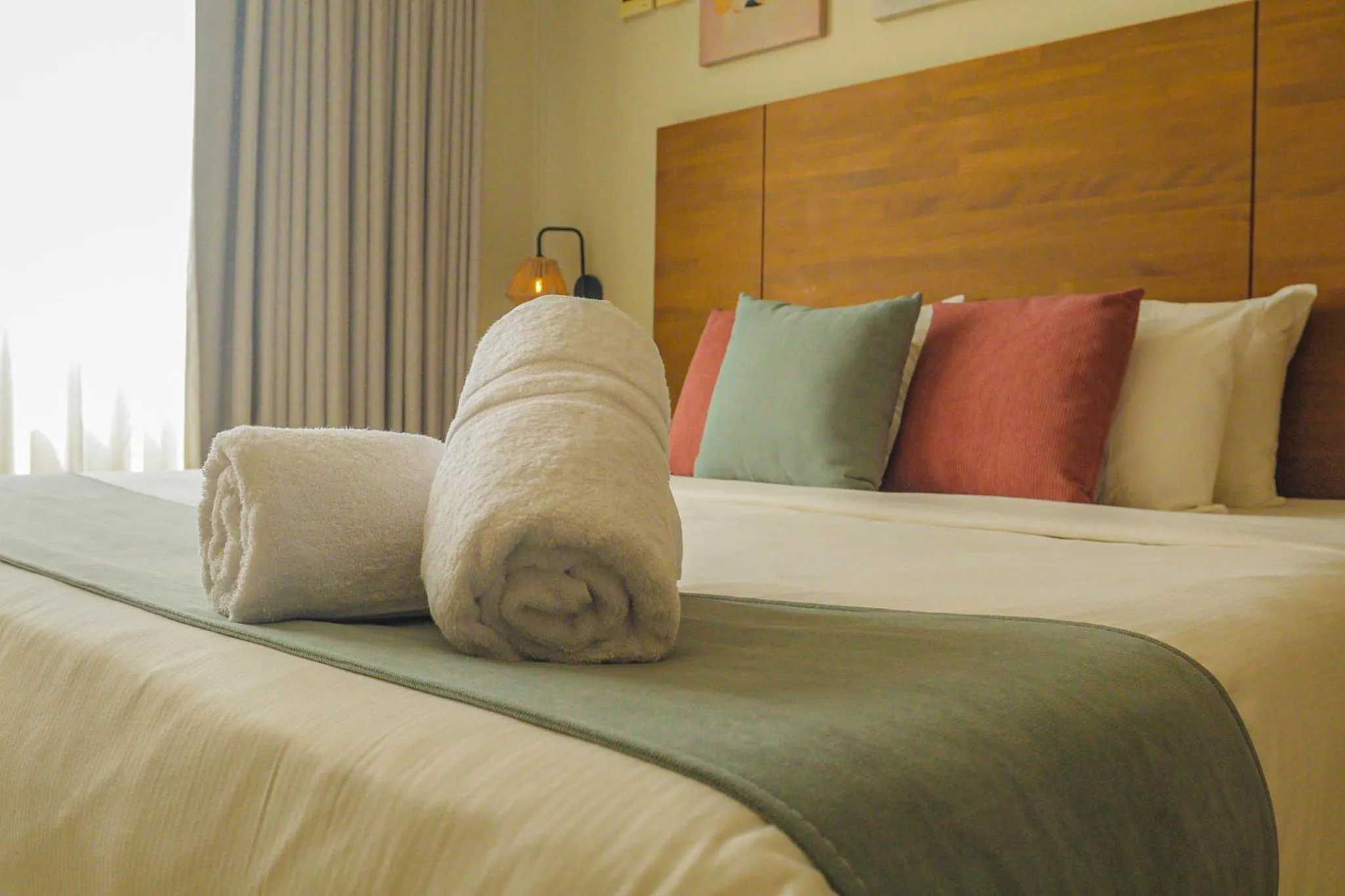 Bed in Majestic City Suites & Beach Hotel