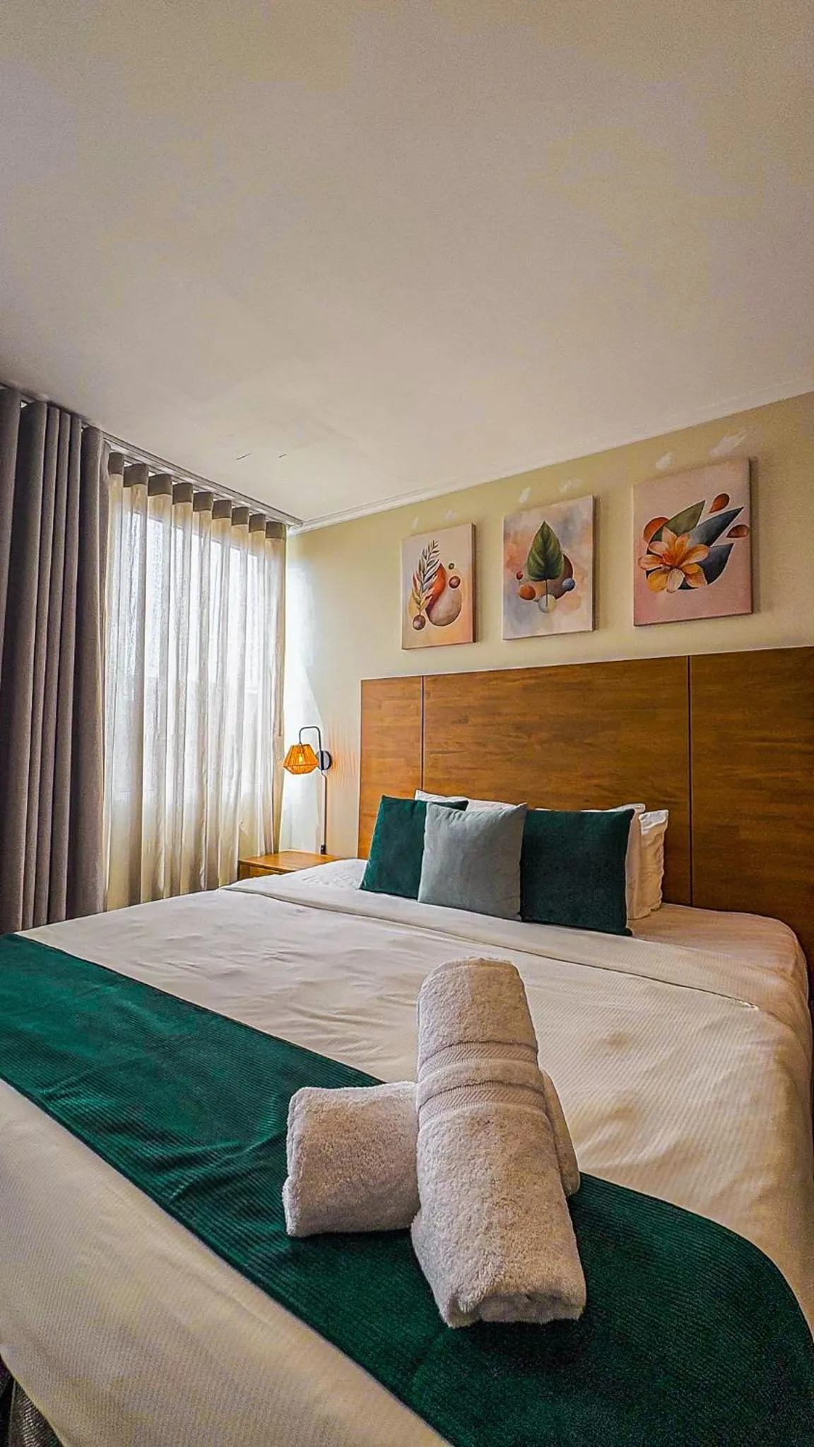 Bed in Majestic City Suites & Beach Hotel