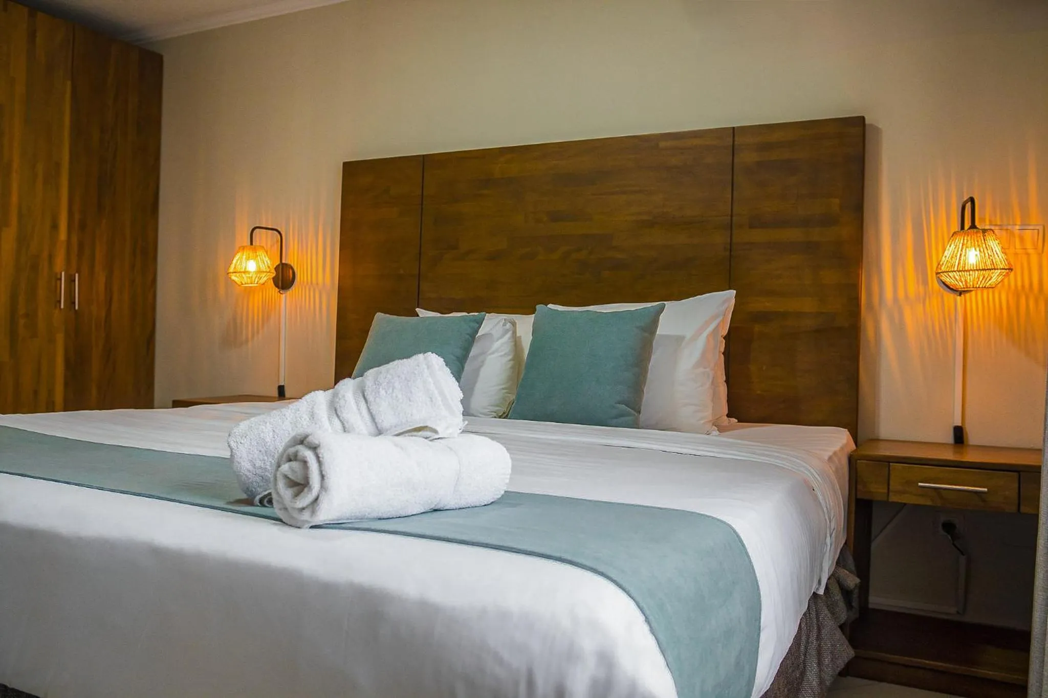 Bed in Majestic City Suites & Beach Hotel