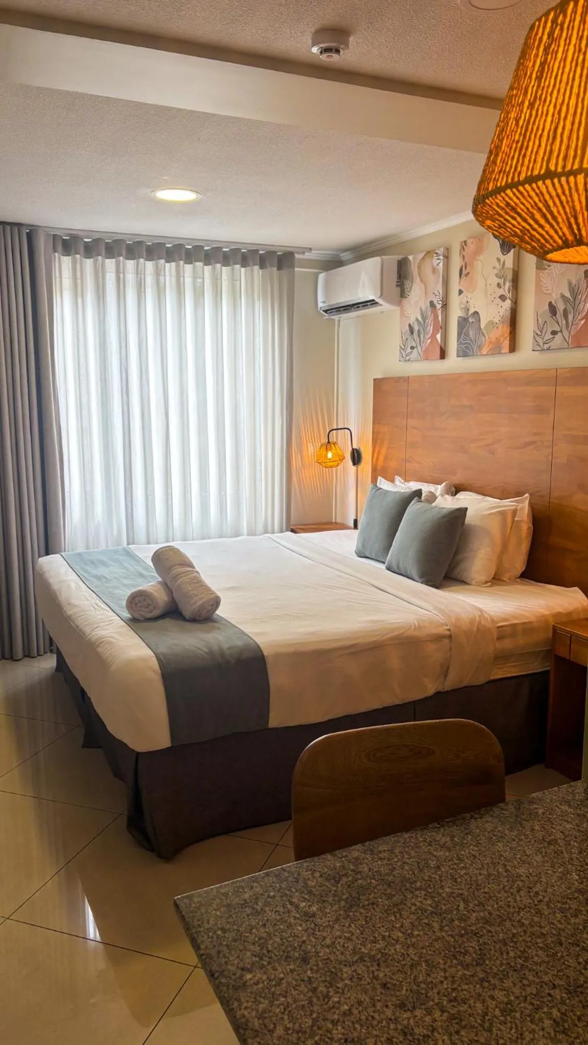 Bed in Majestic City Suites & Beach Hotel