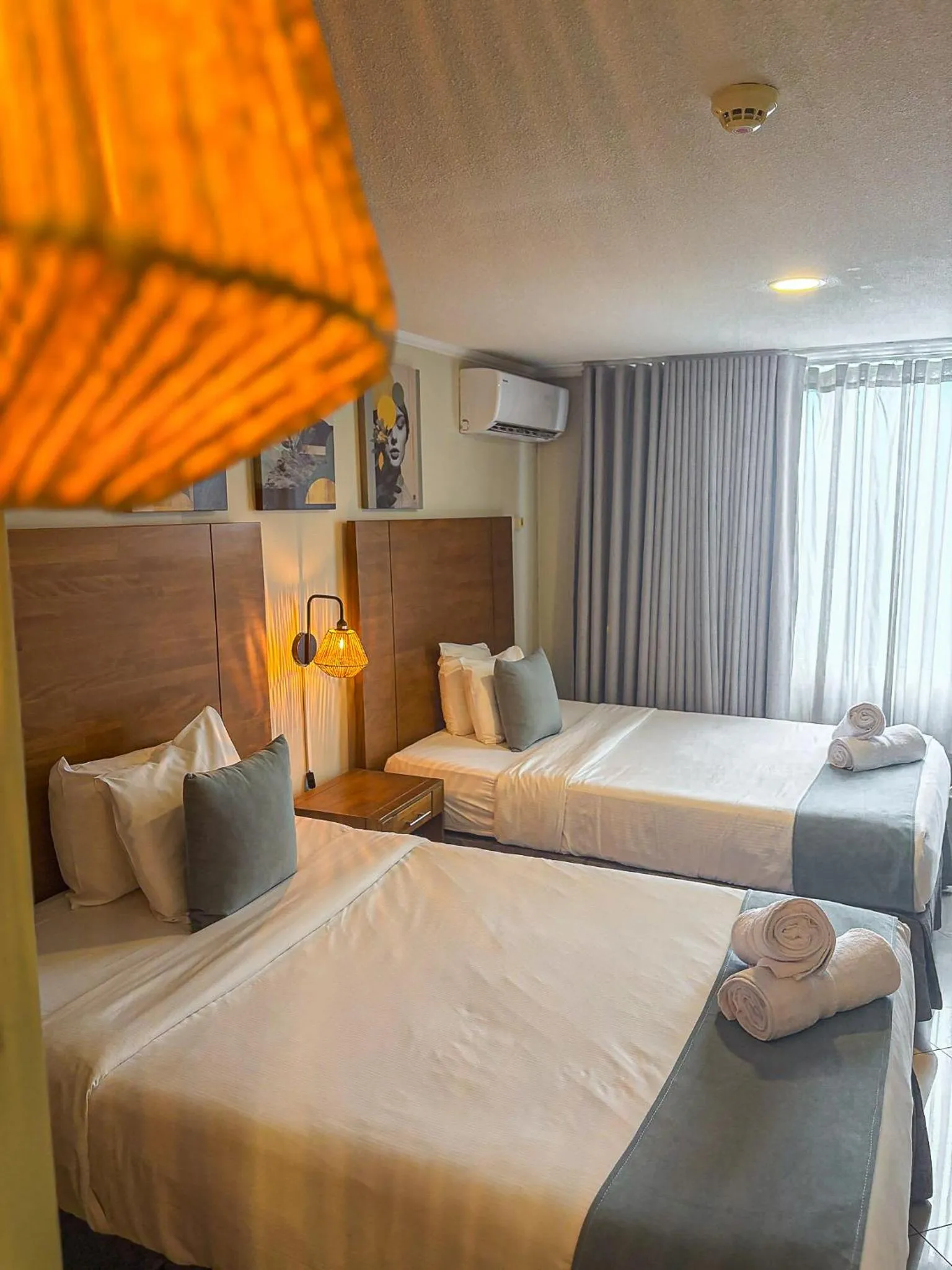Bed in Majestic City Suites & Beach Hotel