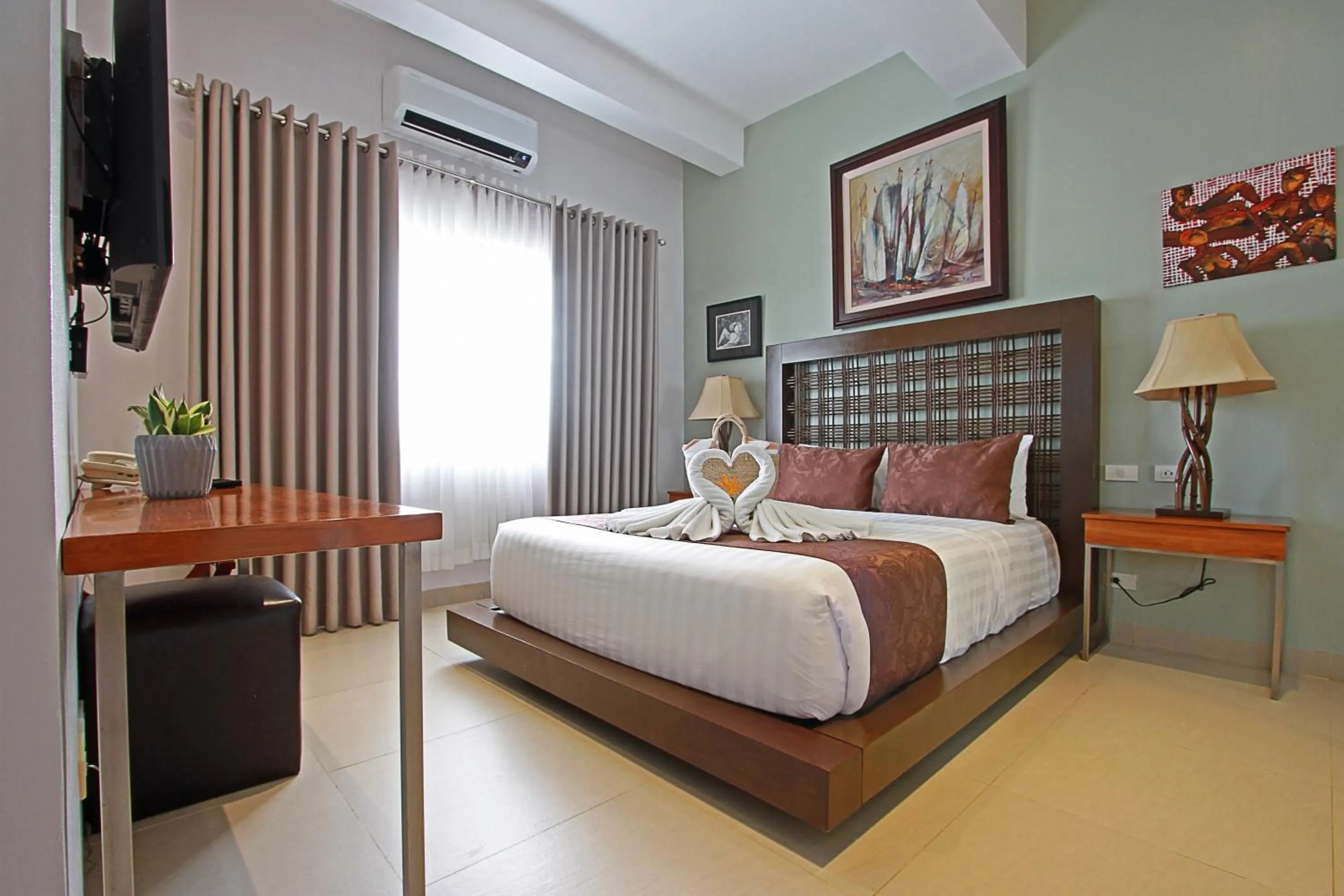 Bed in Aloha Boracay Hotel