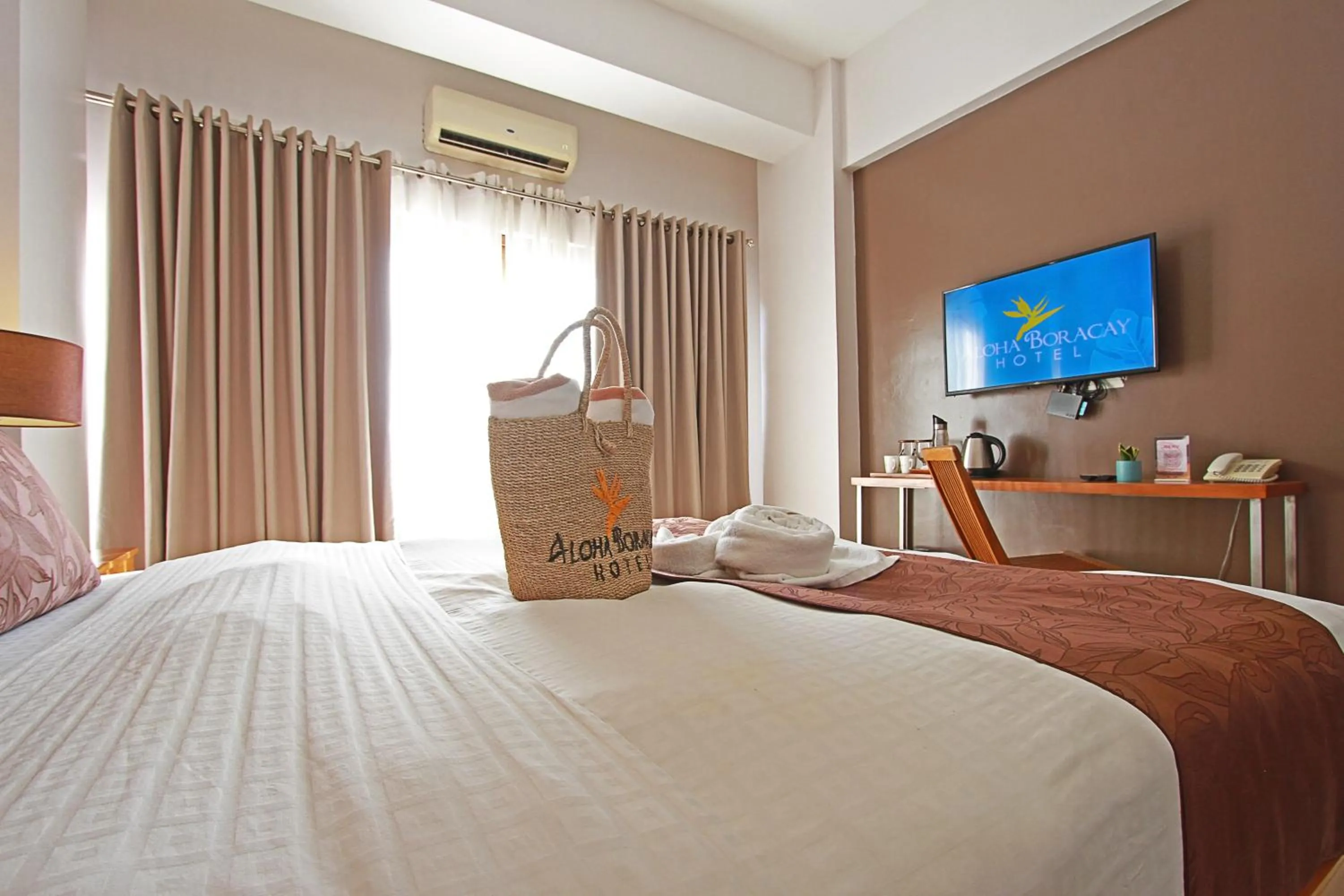 Bed in Aloha Boracay Hotel