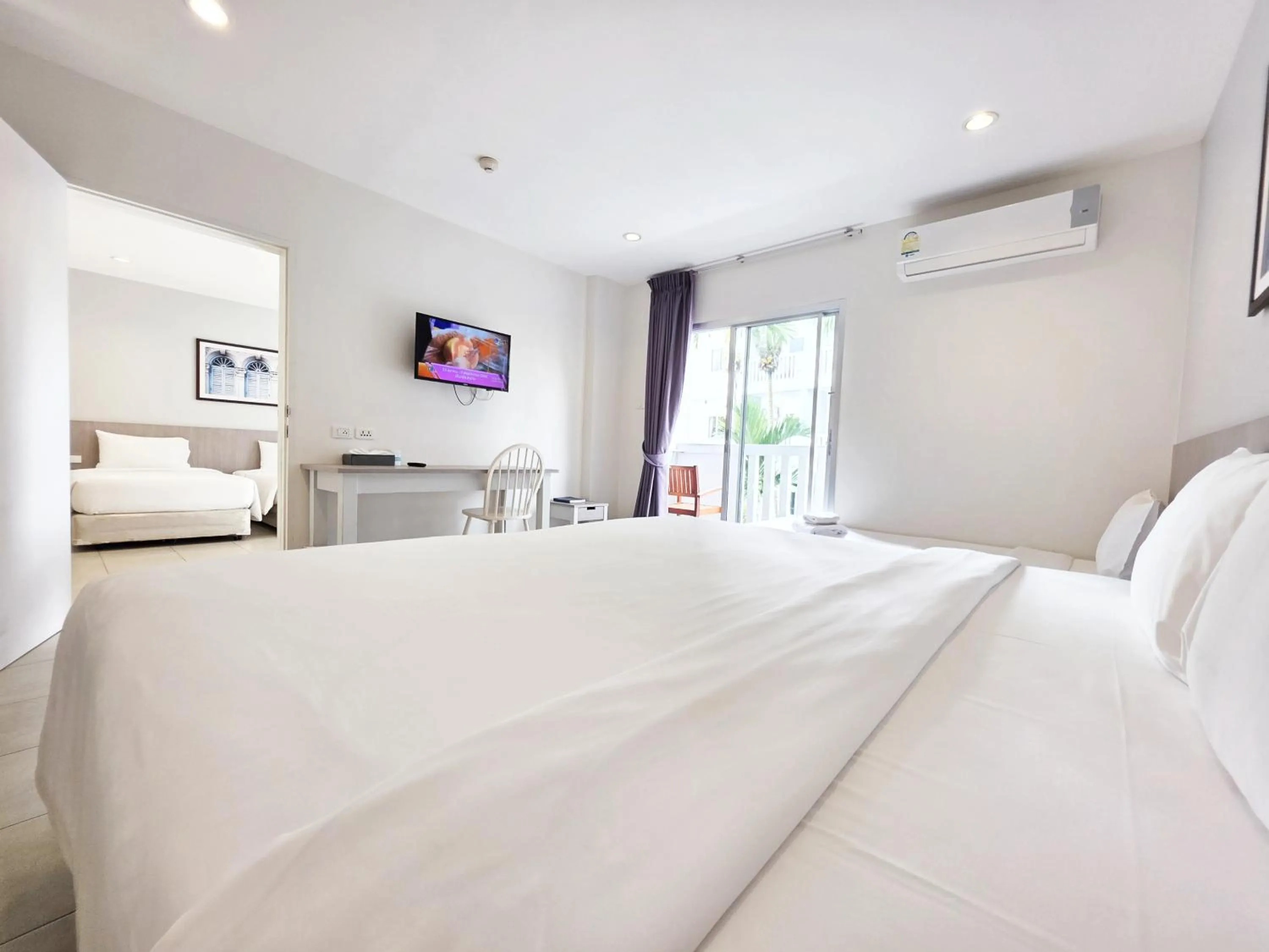 TV and multimedia, Bed in Recenta Phuket Suanluang by Deevana