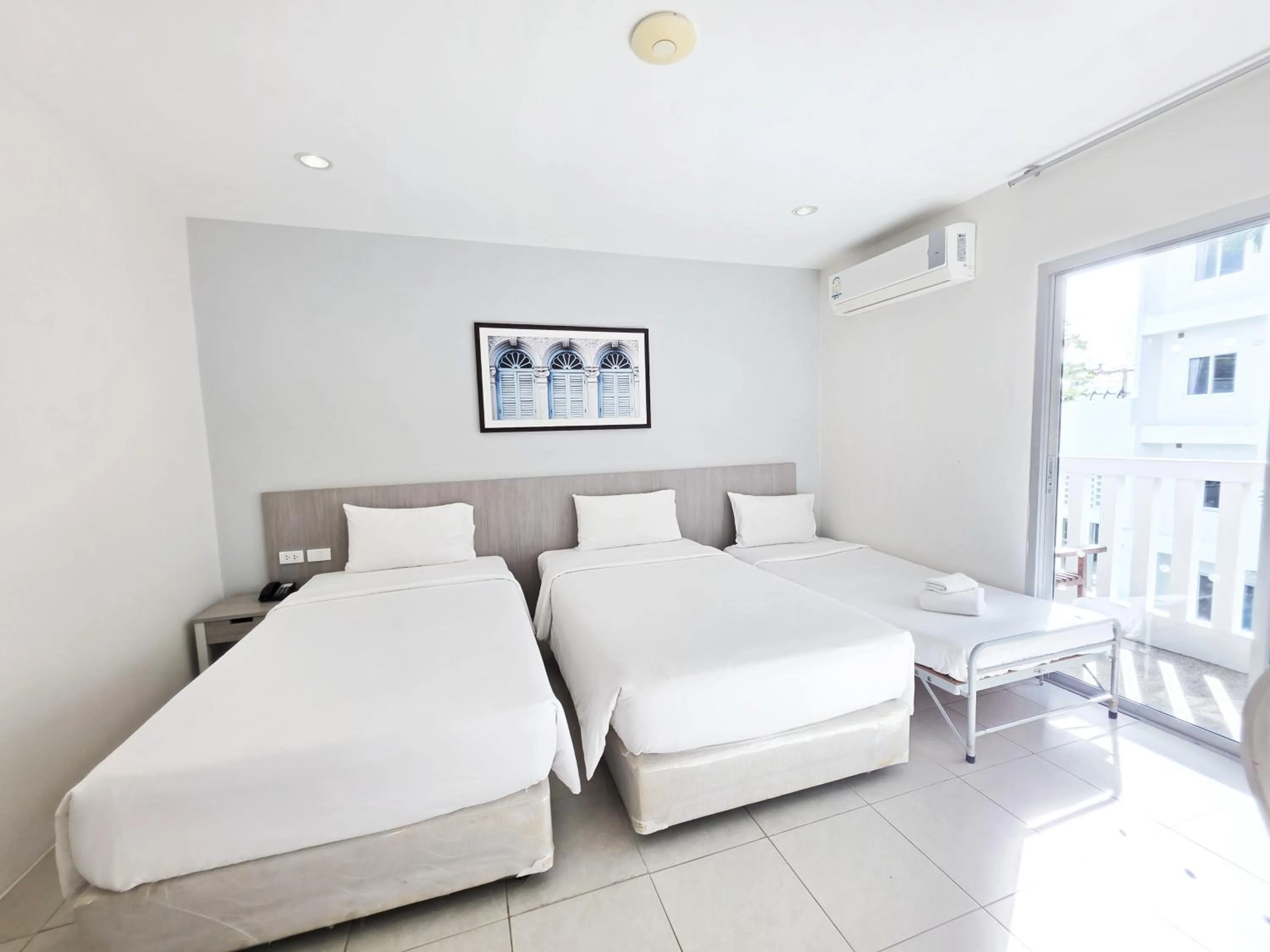 Bed in Recenta Phuket Suanluang by Deevana