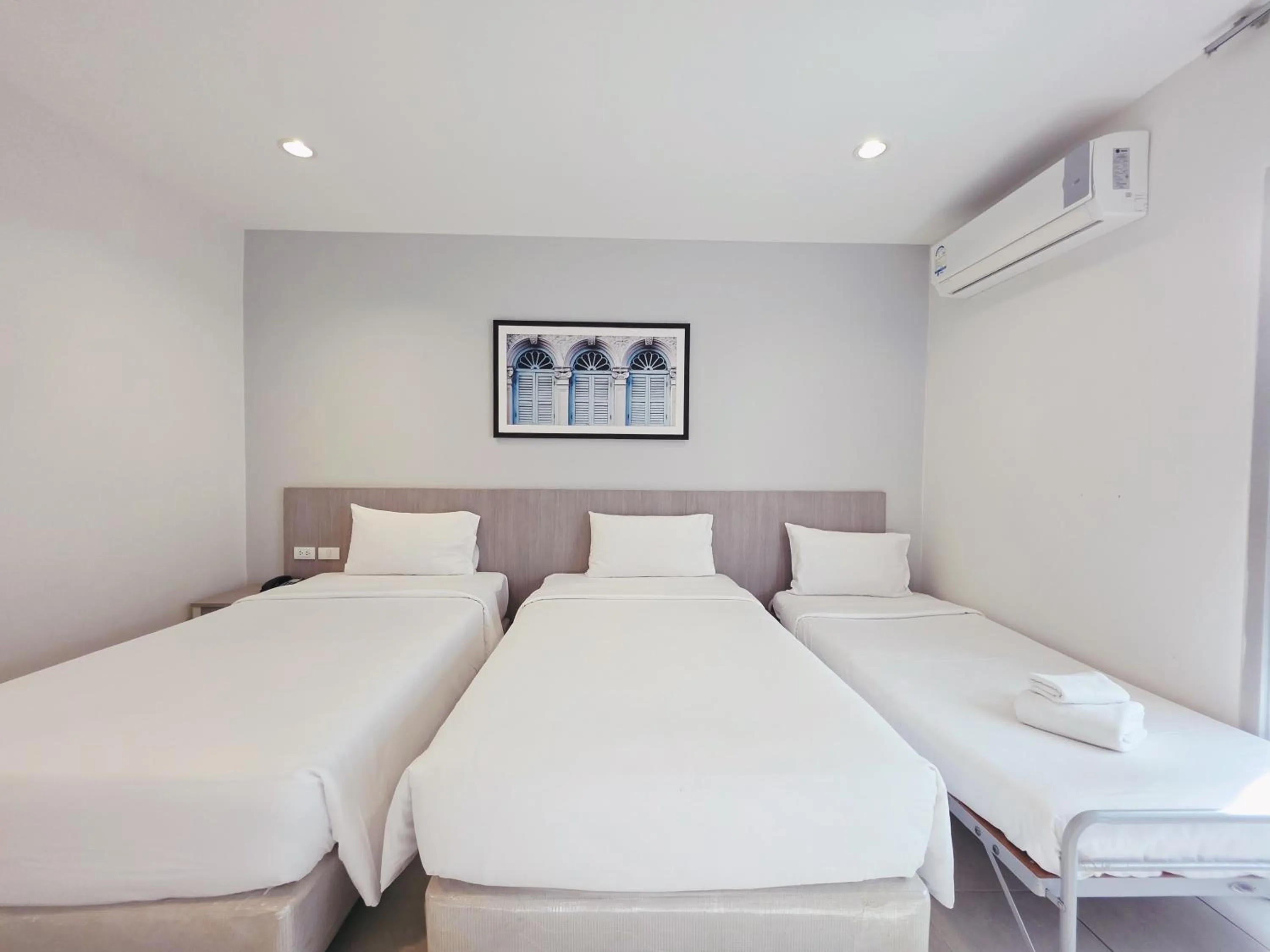 Bed in Recenta Phuket Suanluang by Deevana