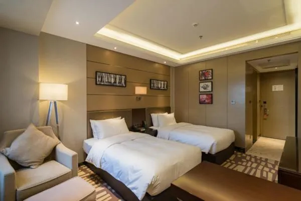 Bed in Meilun Hotel, Tianjin Binhai Development Zone