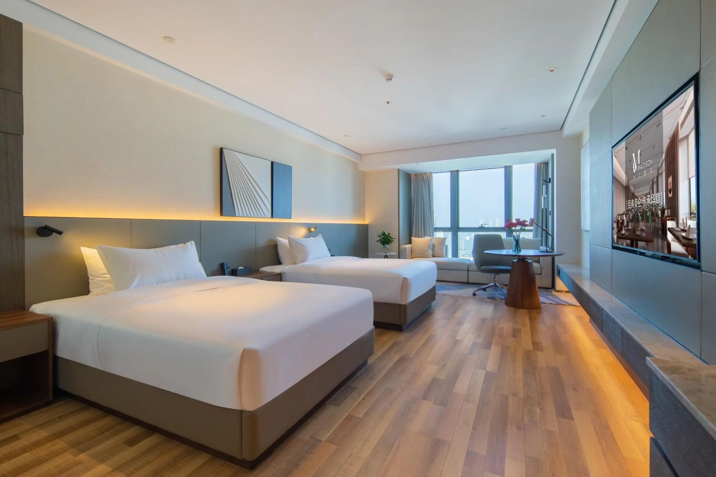 Bed in Madison Hotel Qingdao West Coast City Balcony