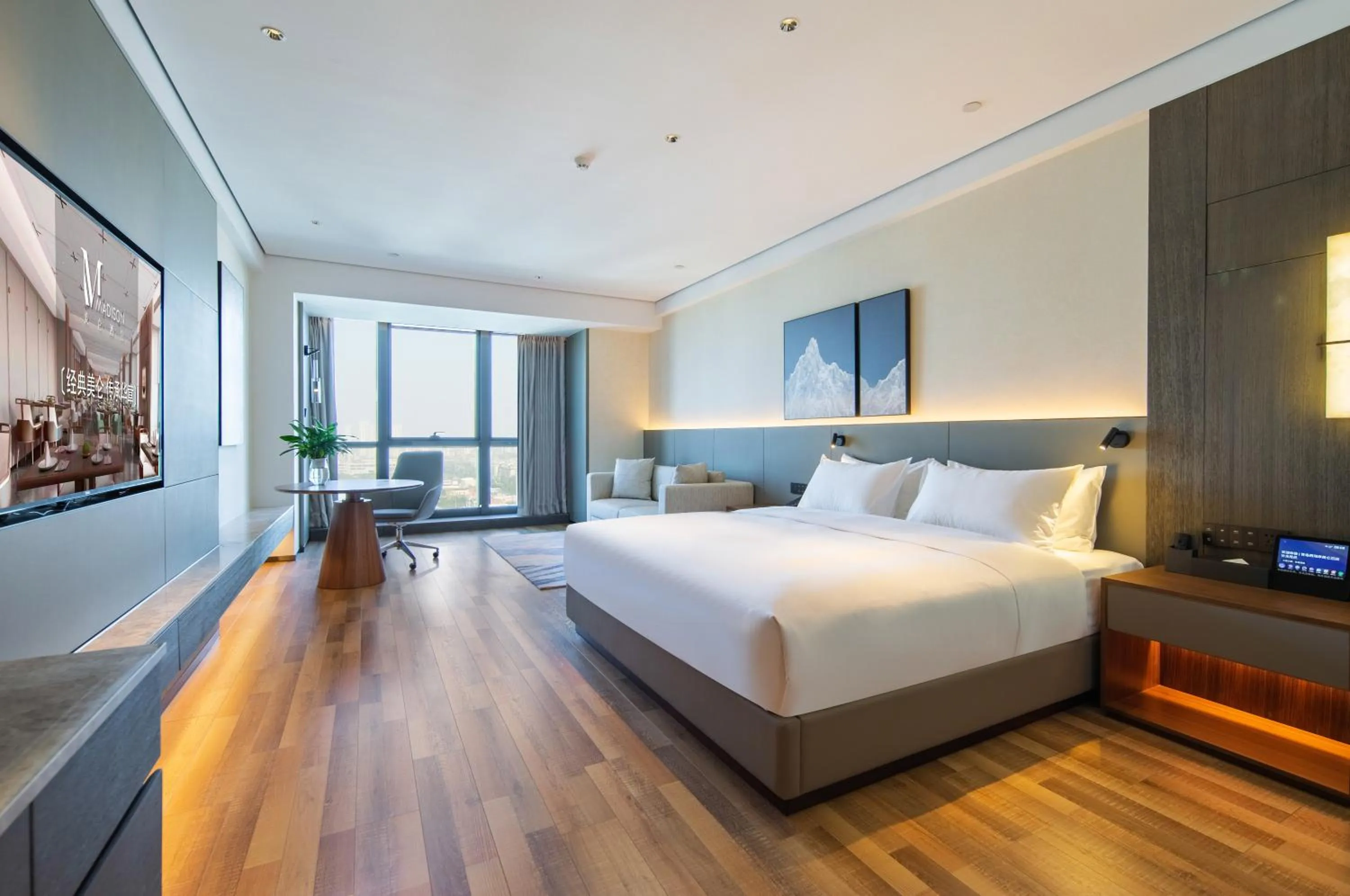 Bed in Madison Hotel Qingdao West Coast City Balcony