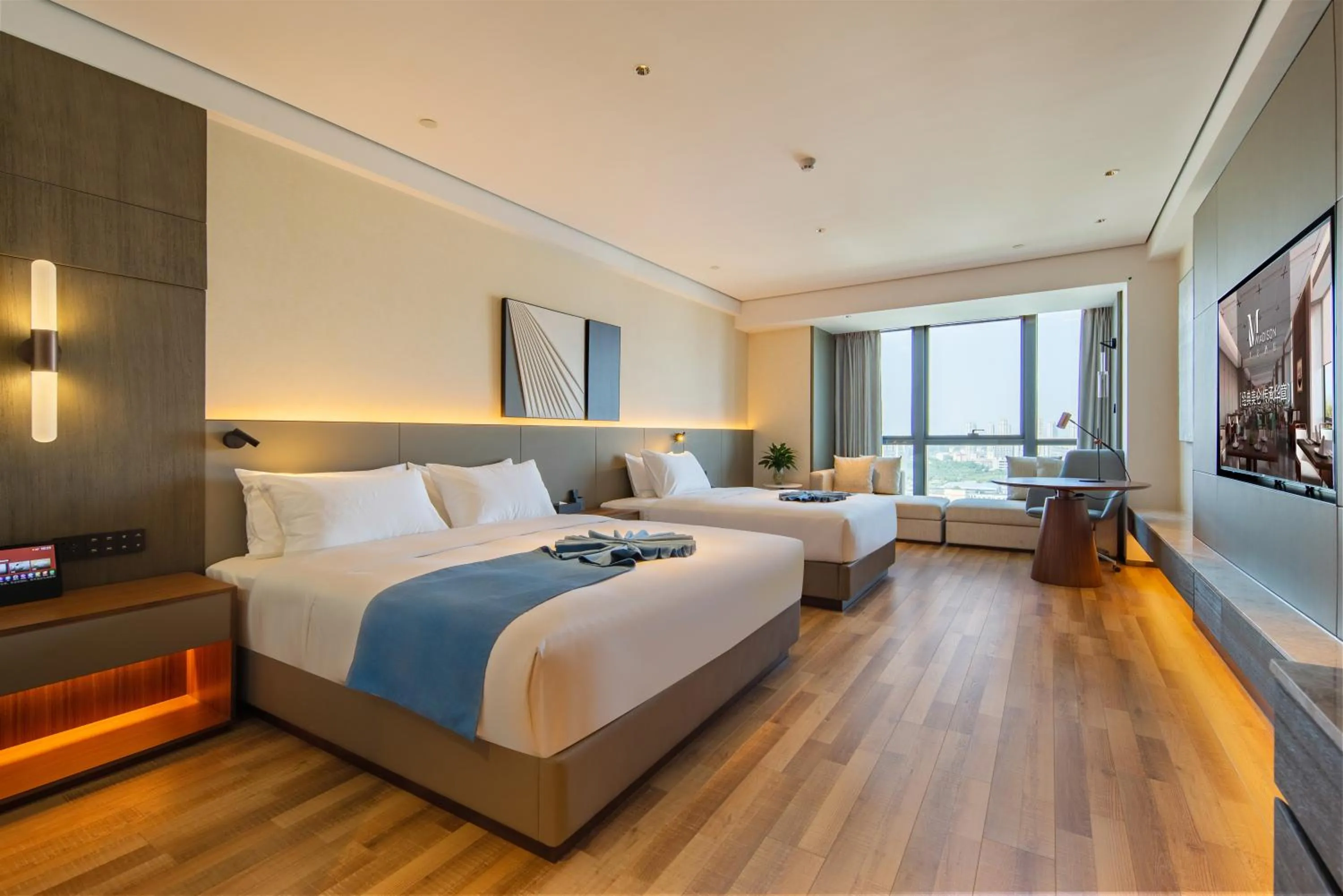 Bed in Madison Hotel Qingdao West Coast City Balcony