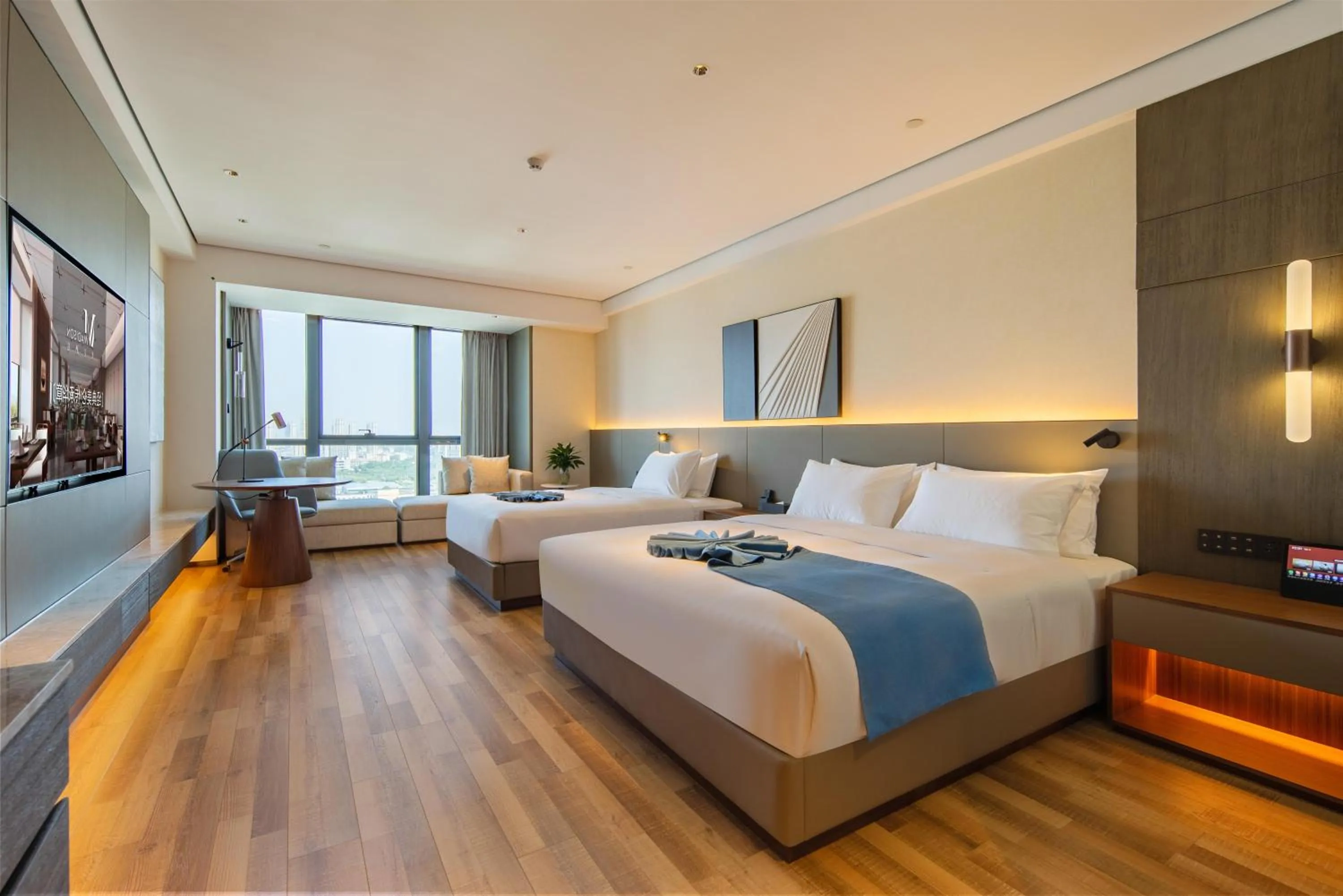 Bed in Madison Hotel Qingdao West Coast City Balcony