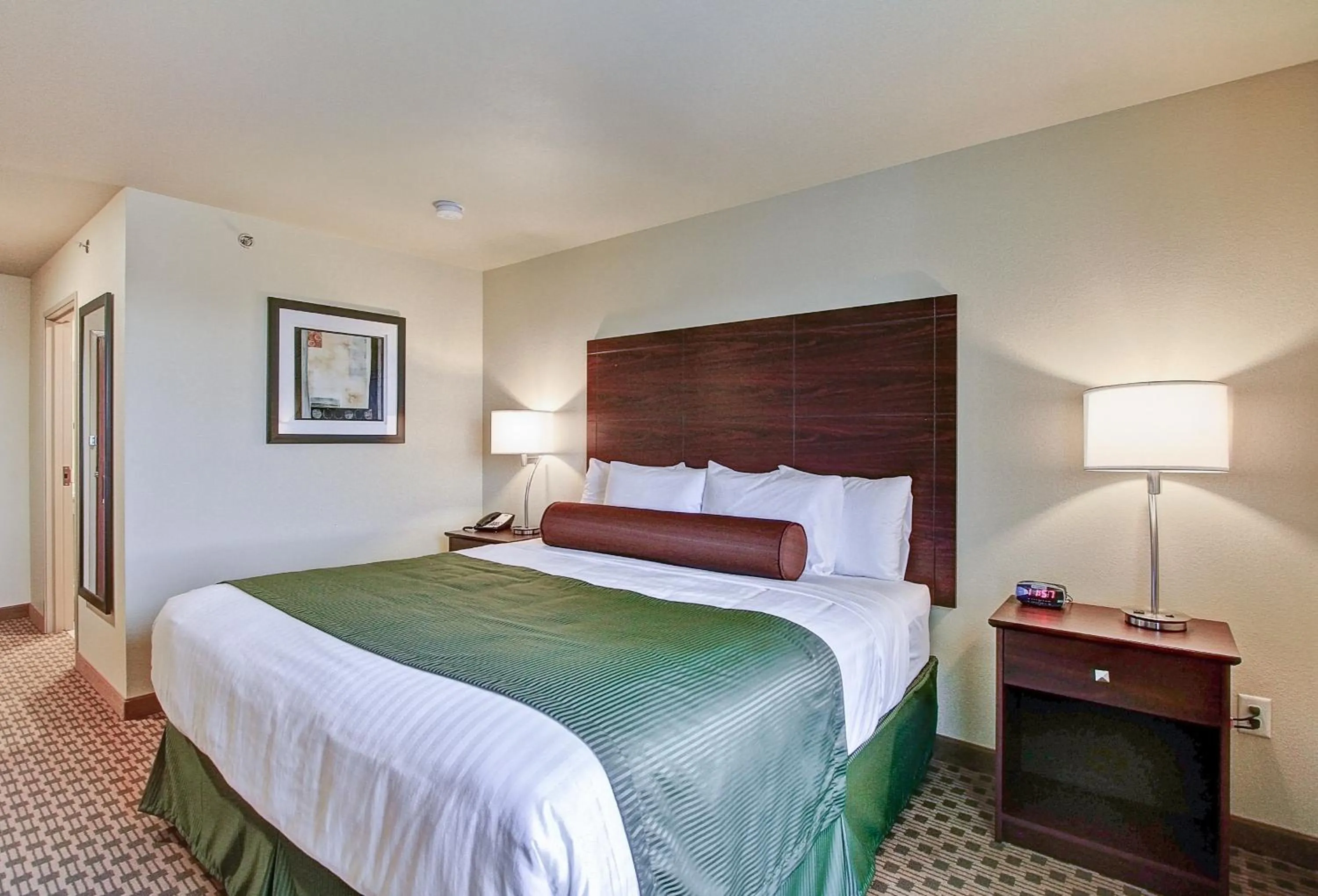 Bed in Castle Rock Inn & Suites - Quinter