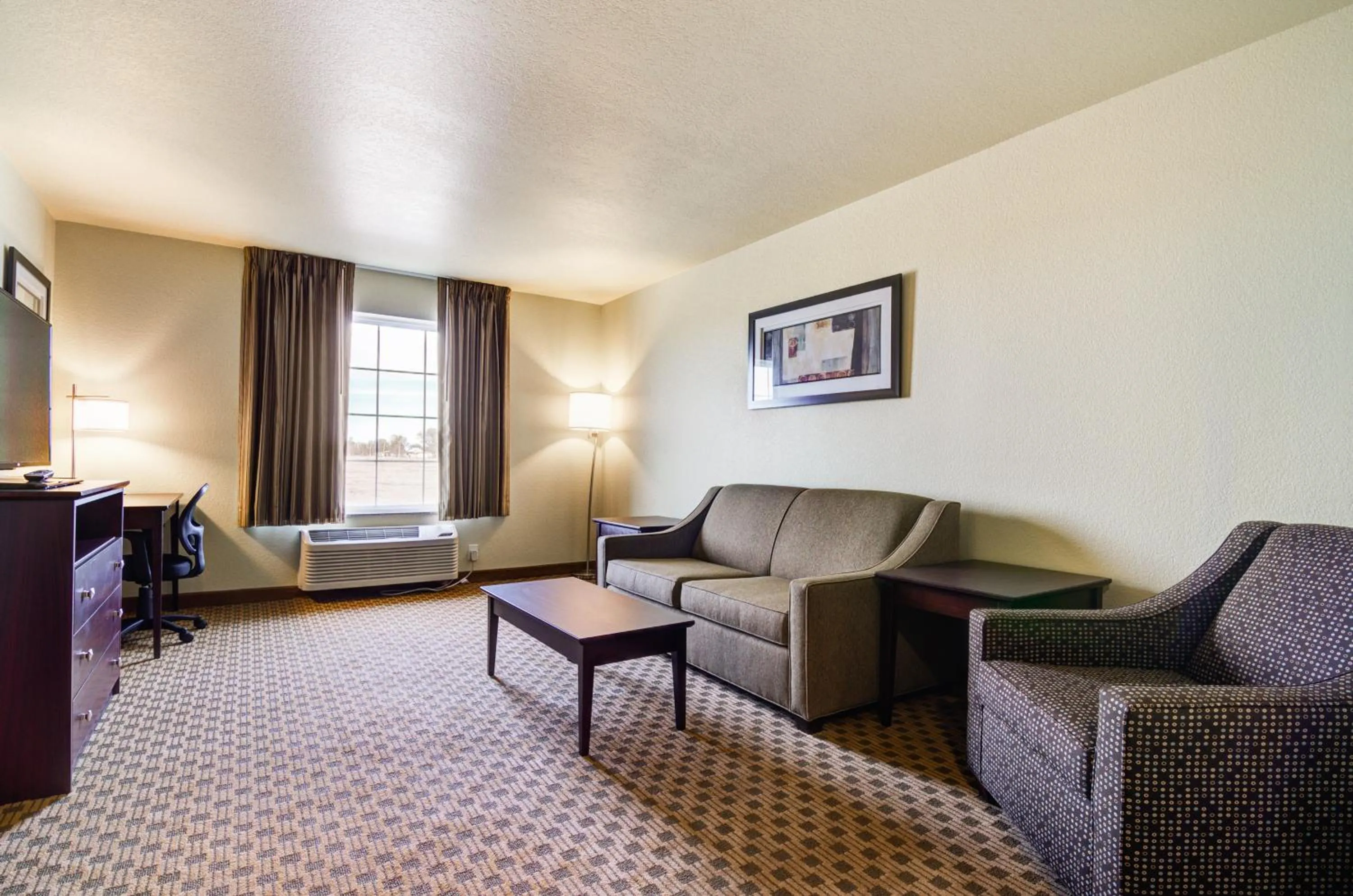 Bed in Castle Rock Inn & Suites - Quinter