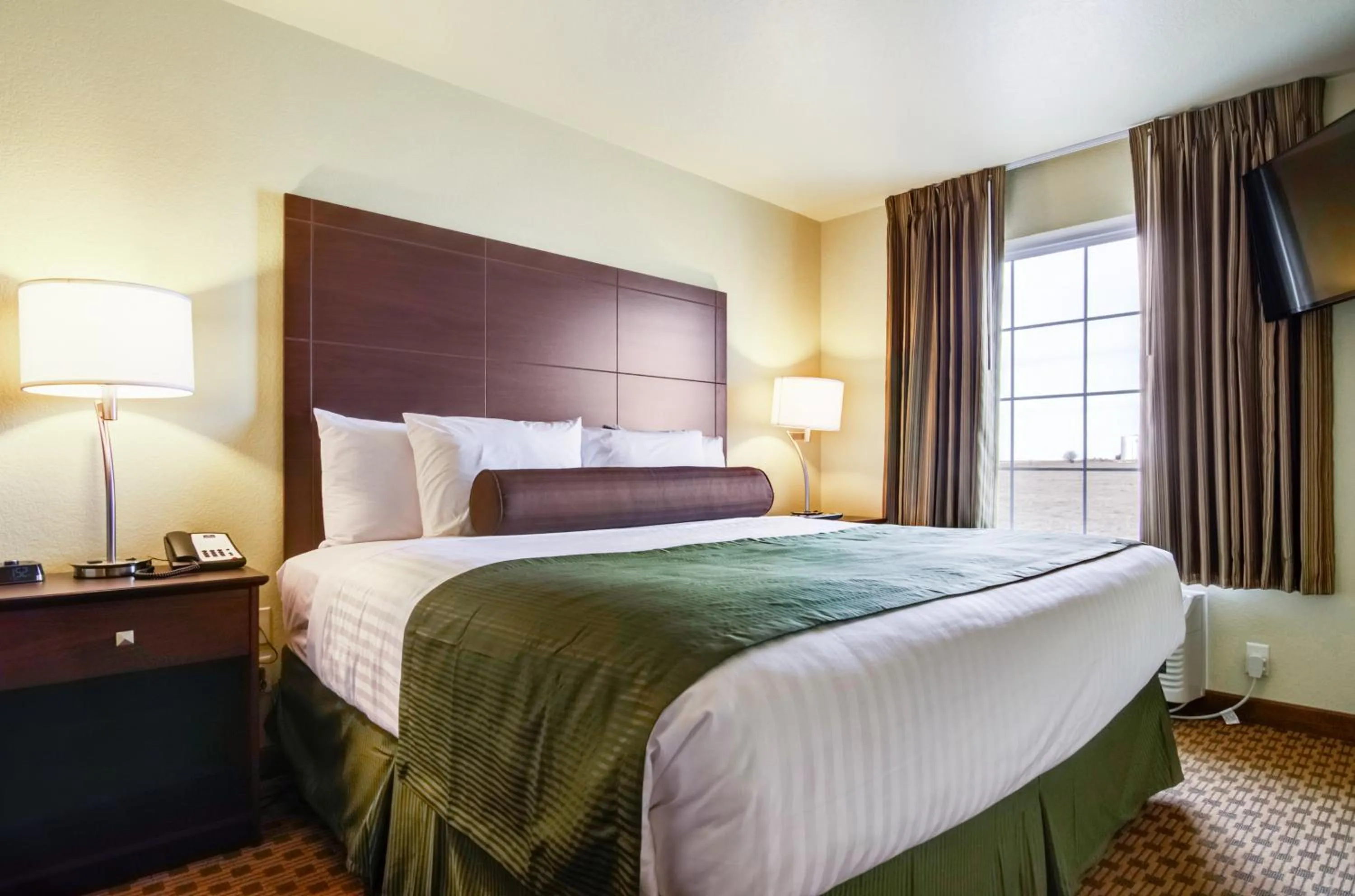 Bed in Castle Rock Inn & Suites - Quinter