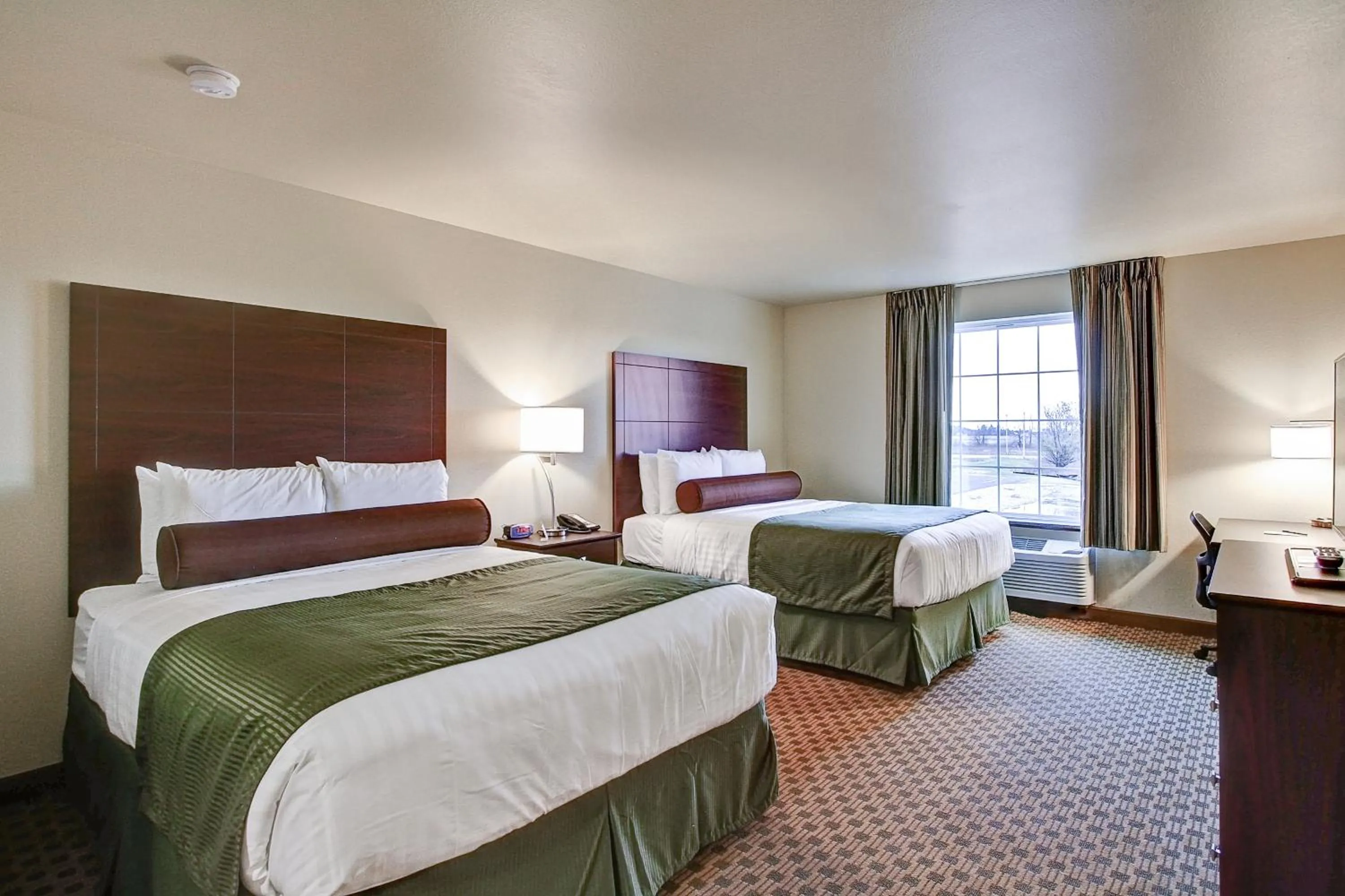 Bed in Castle Rock Inn & Suites - Quinter