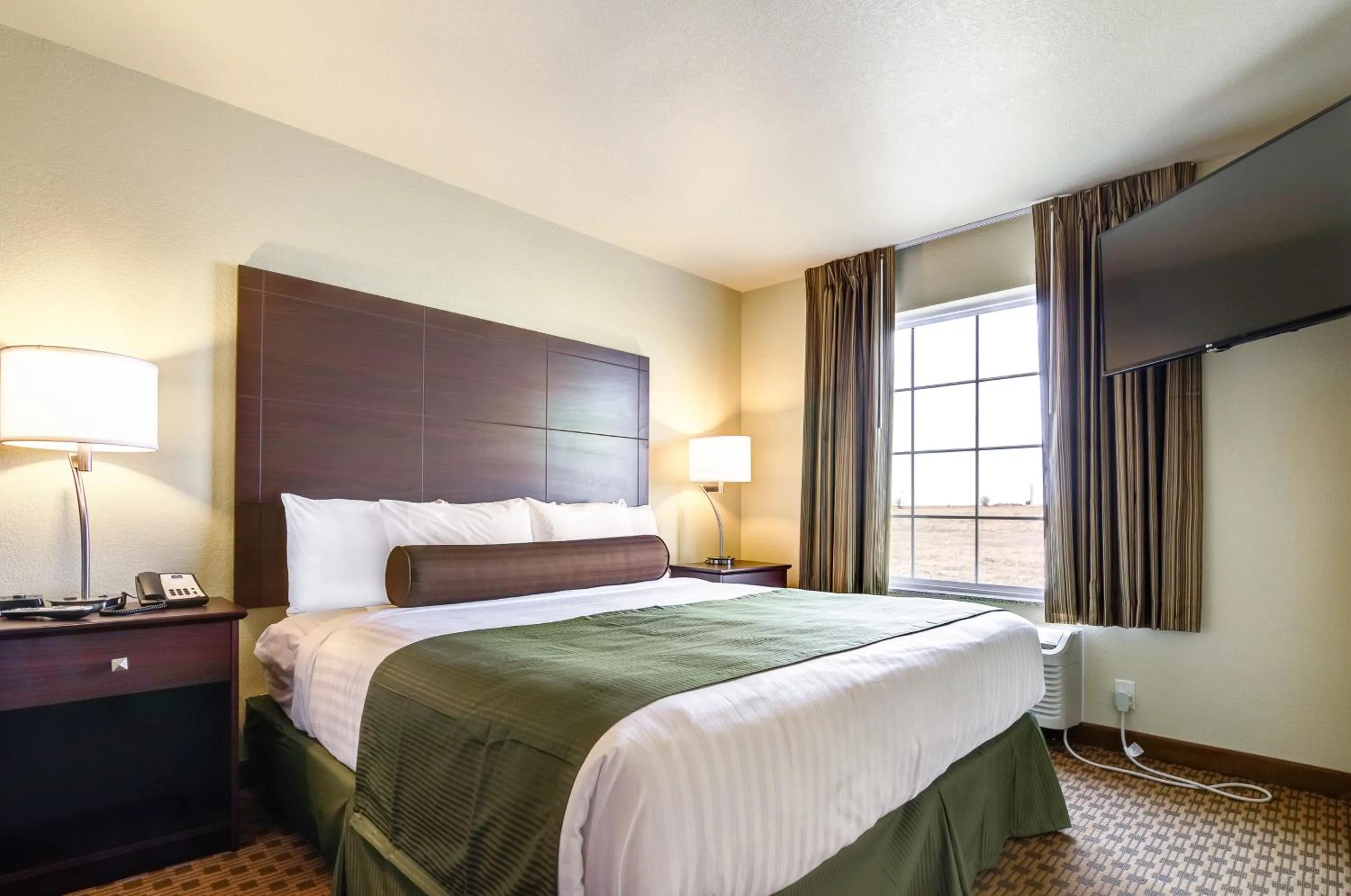 Bed in Castle Rock Inn & Suites - Quinter