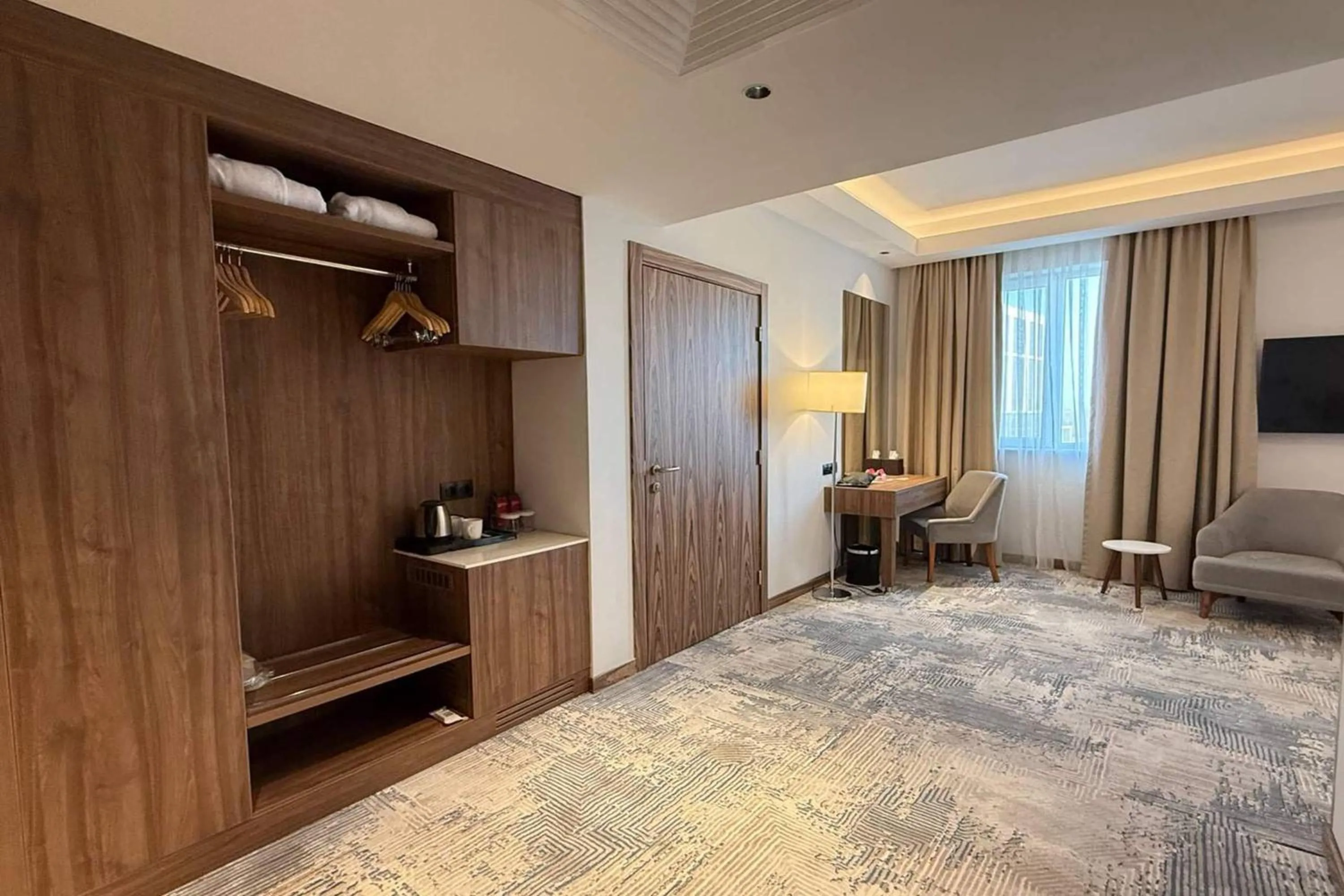 Photo of the whole room, Bed in Ramada Encore by Wyndham Bukhara