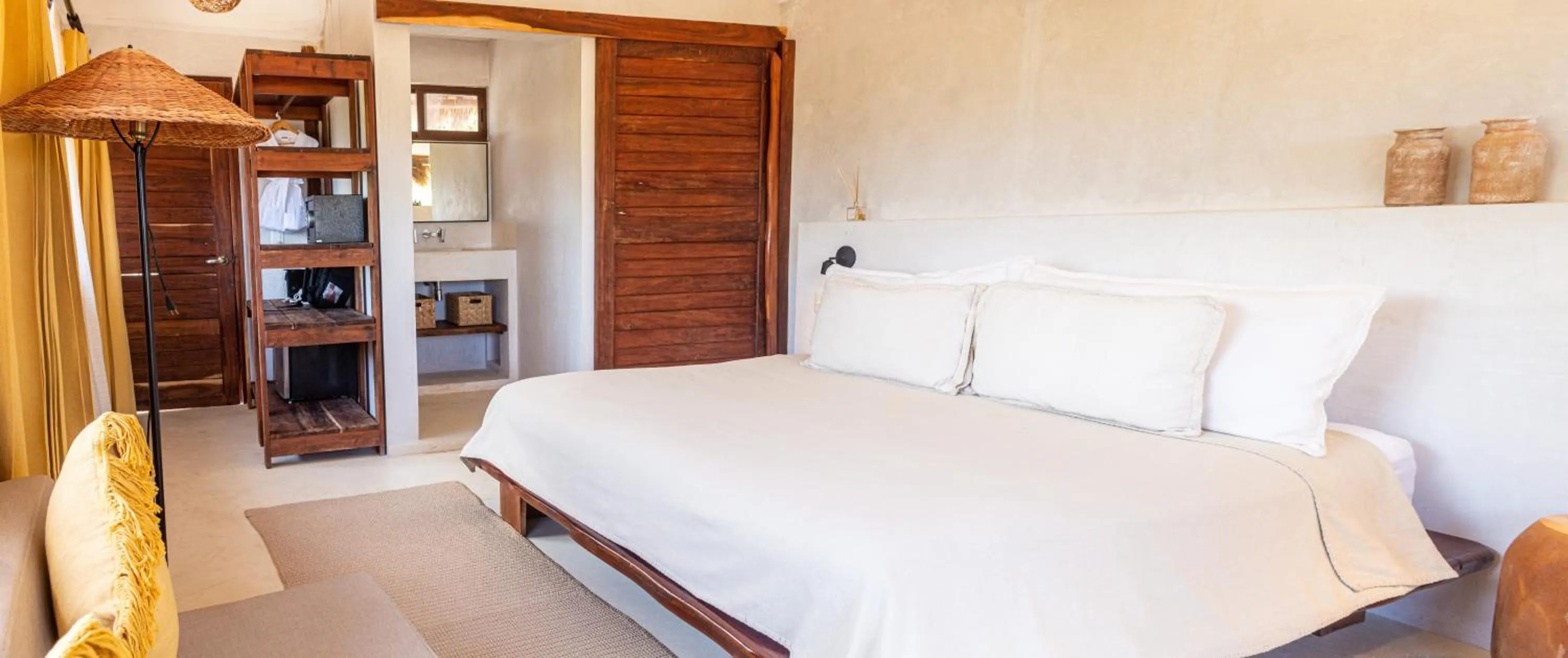 Bed in Dune Boutique Hotel located at the party zone