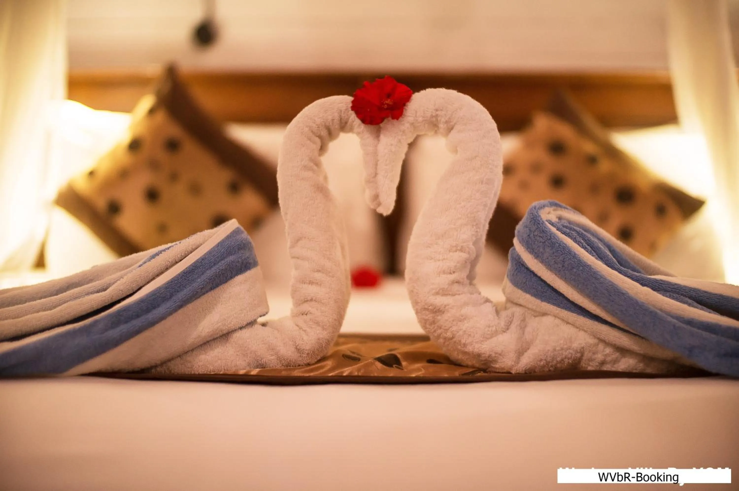 towels, Bed in Warisan Villa By Reccoma