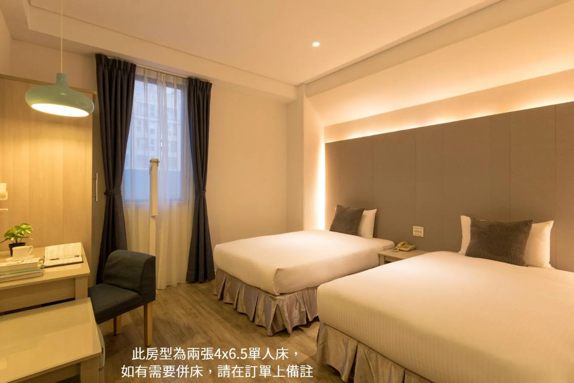 Bed in Just Enjoy Business Hotel