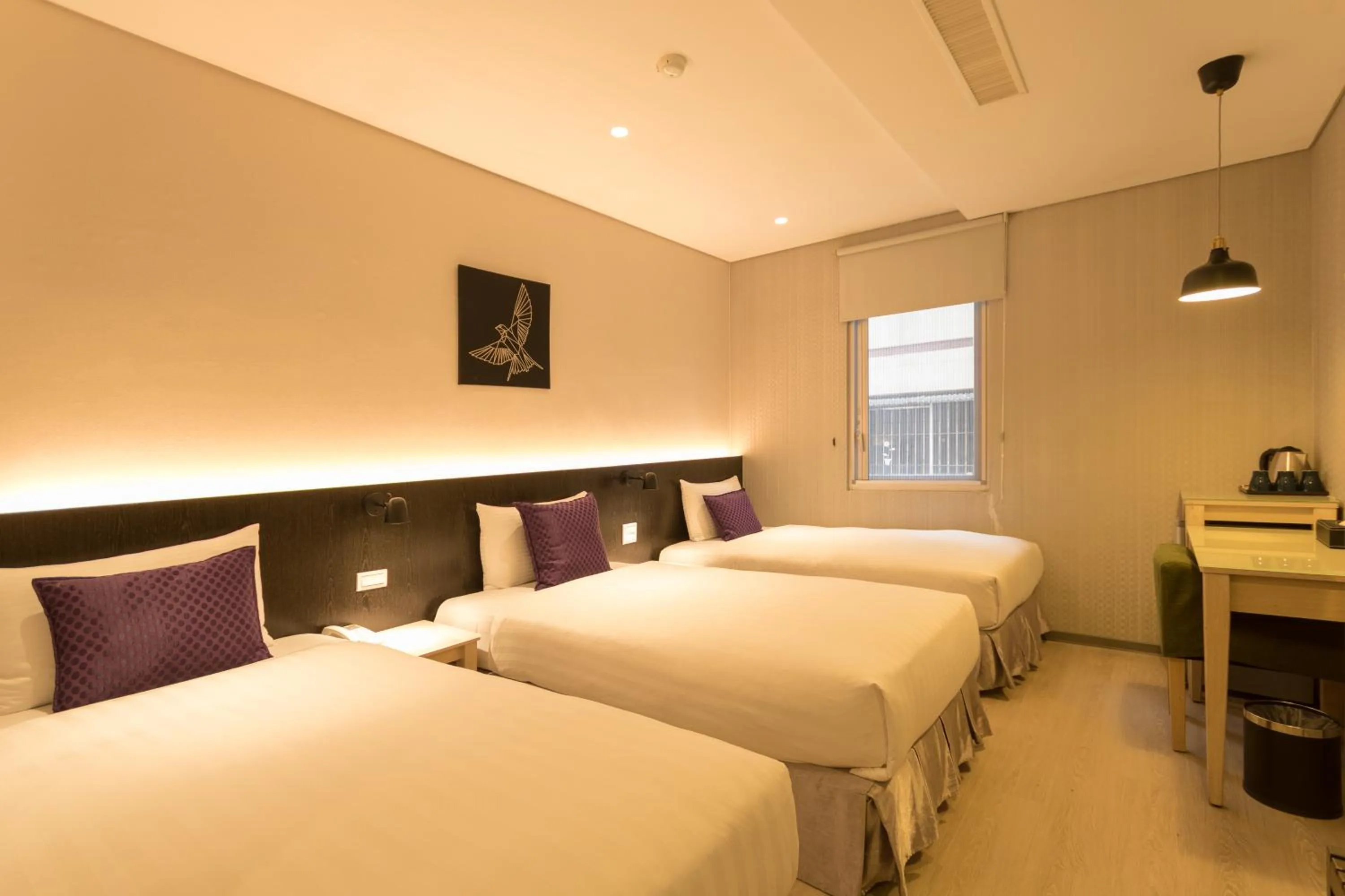 Bed in Just Enjoy Business Hotel