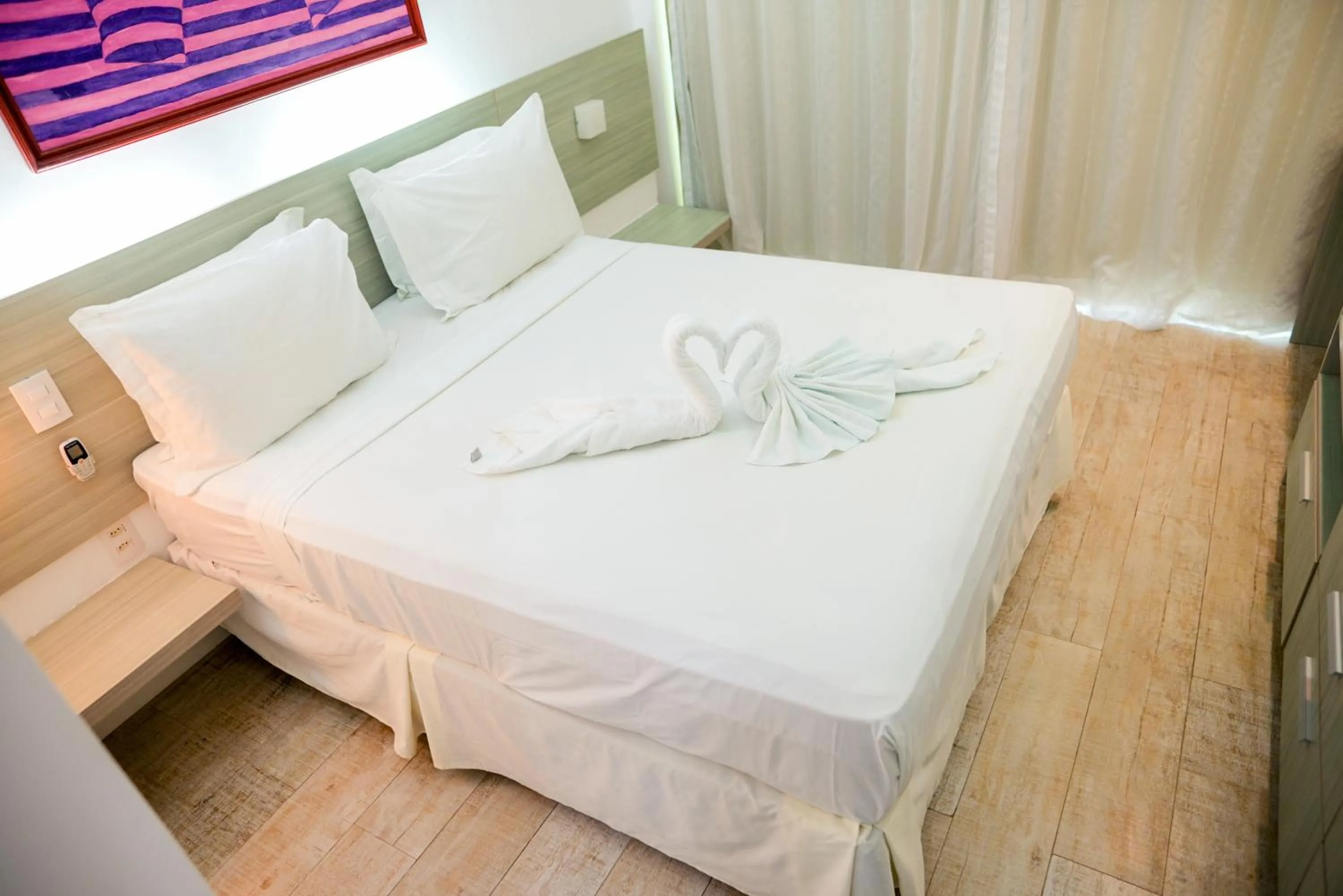 Bed in Waterfront Apart Hotel