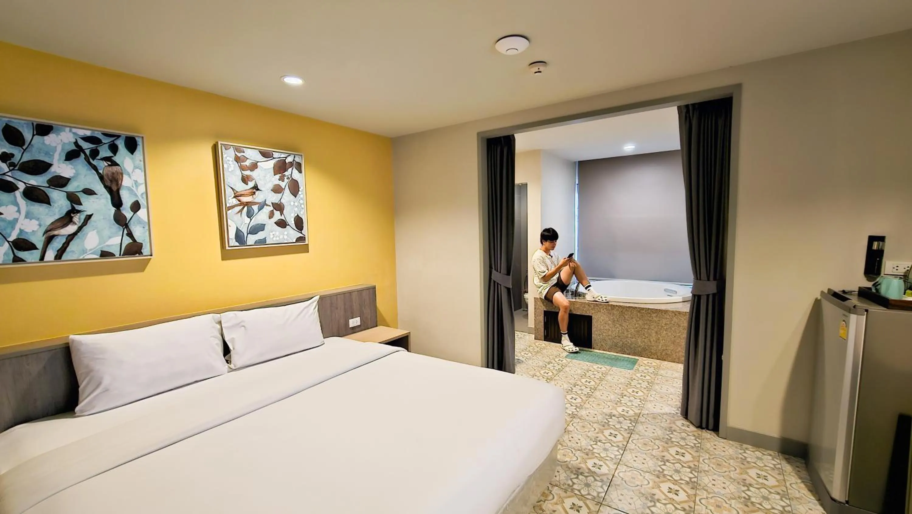 Bed in Recenta Suite Phuket Suanluang