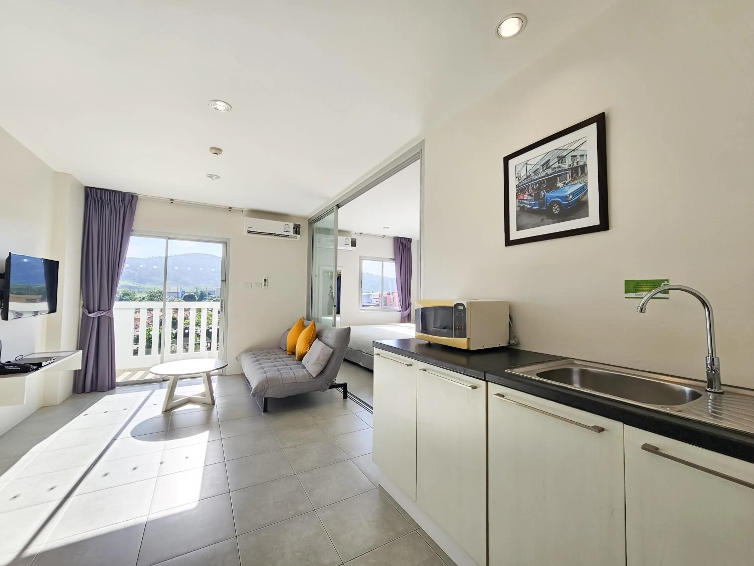 Kitchen or kitchenette in Recenta Suite Phuket Suanluang