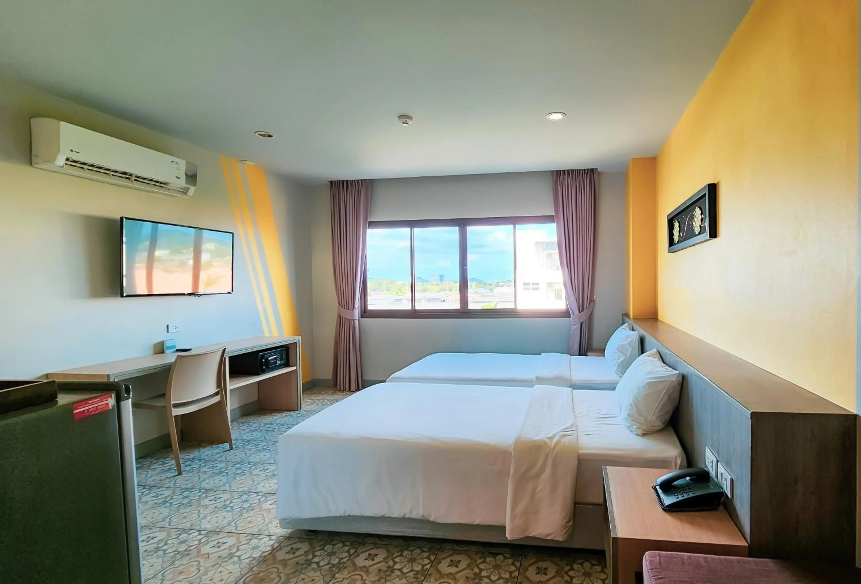 Bed in Recenta Suite Phuket Suanluang