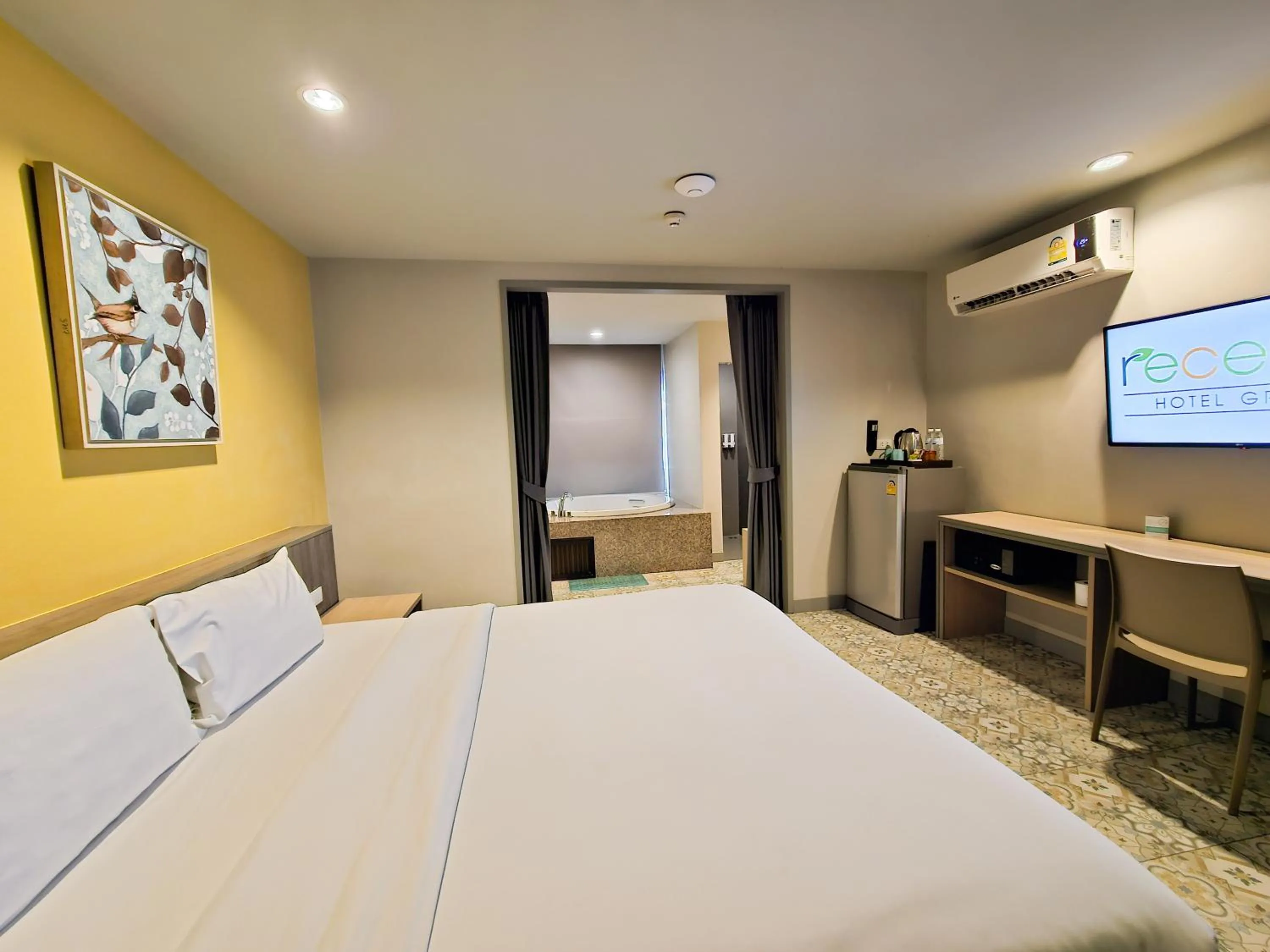Bed in Recenta Suite Phuket Suanluang
