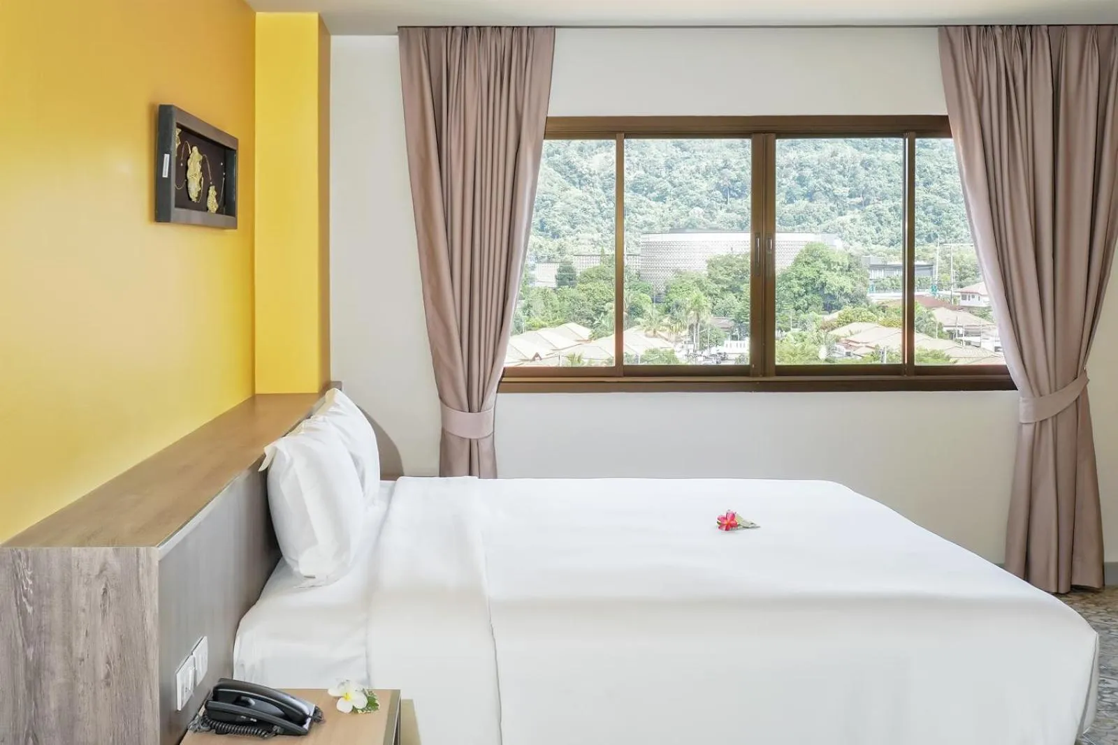 Bed in Recenta Suite Phuket Suanluang