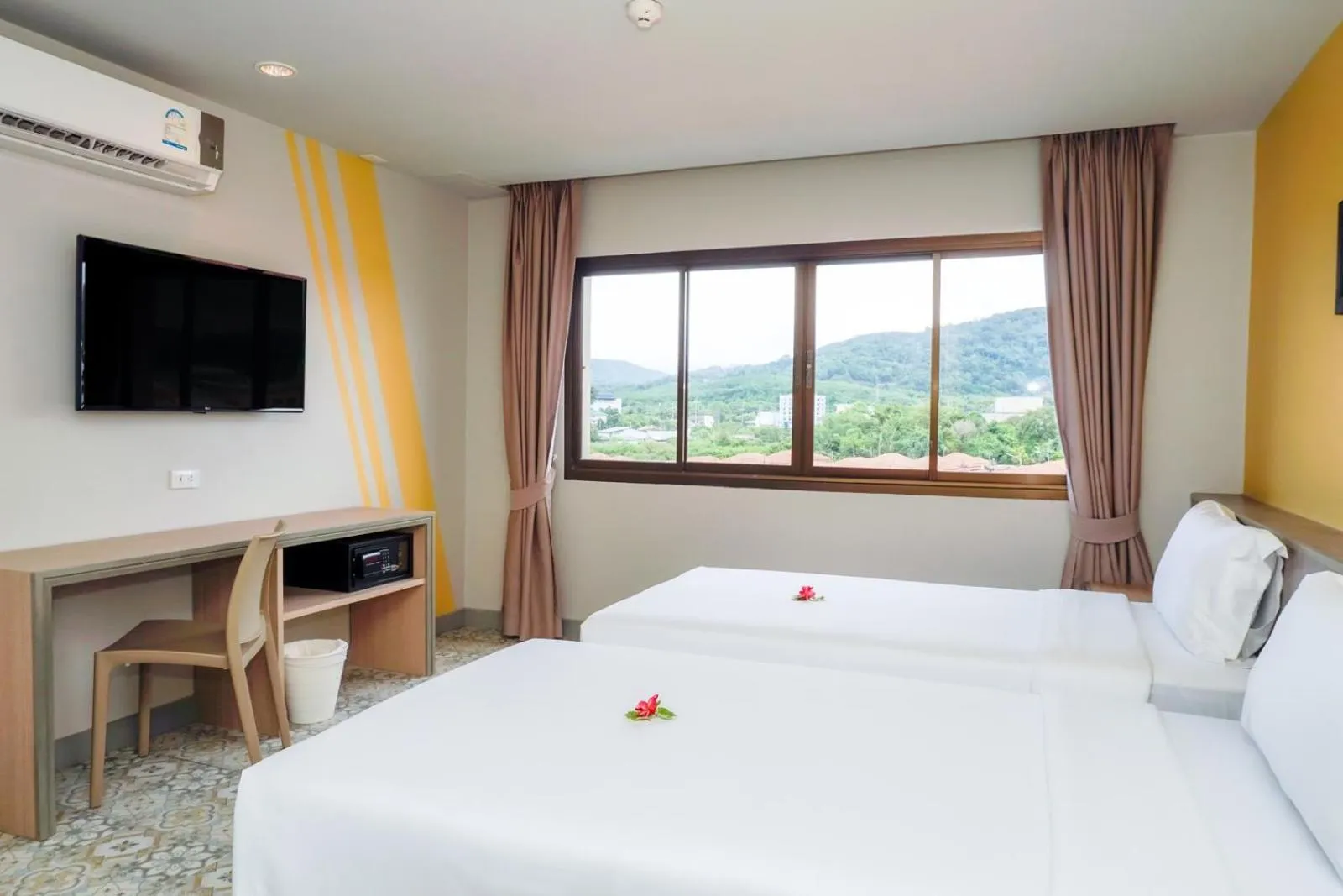 Bed in Recenta Suite Phuket Suanluang
