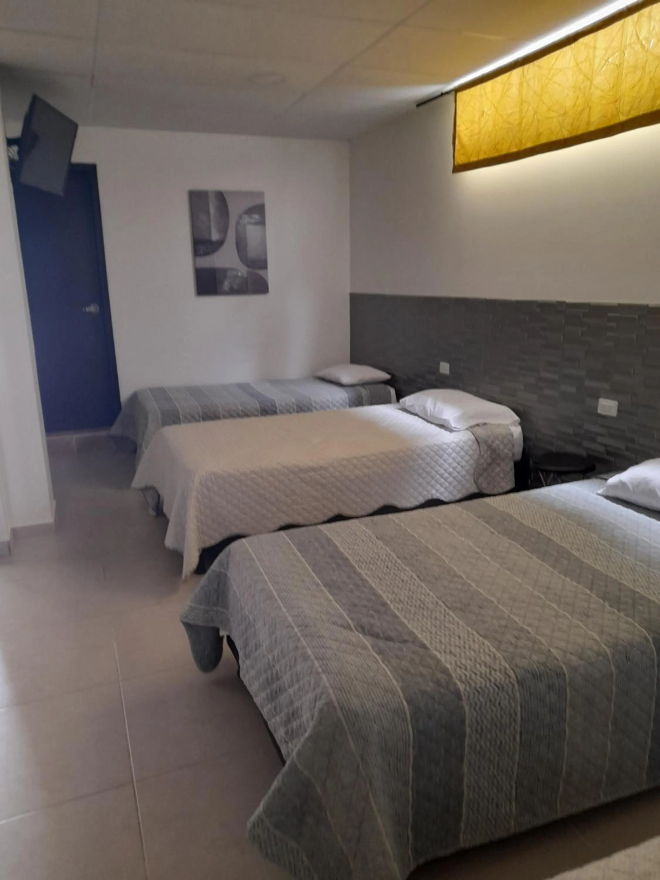 Bed in Las Piloneras Apartahotel