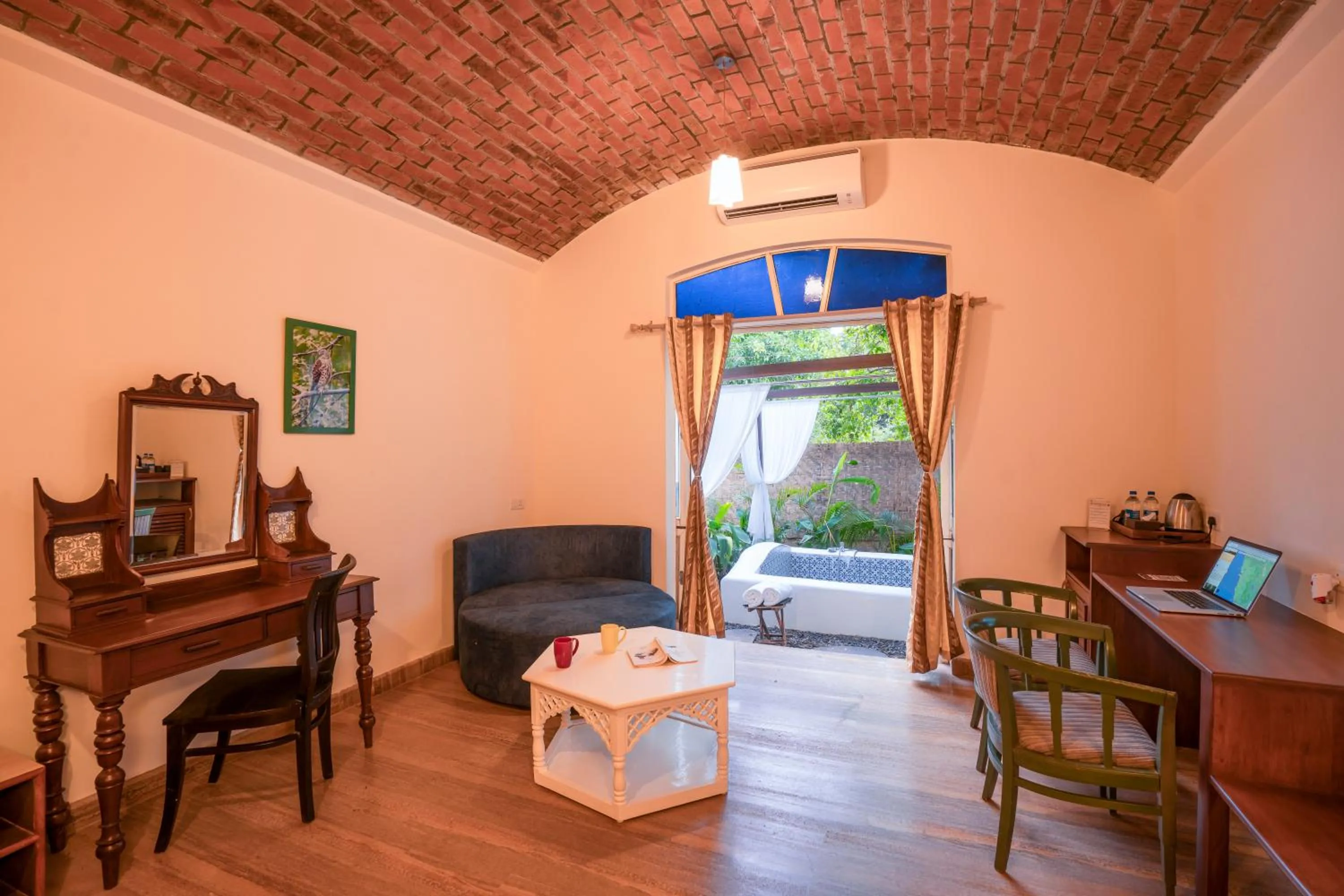 Seating area in Moustache Goa Luxuria