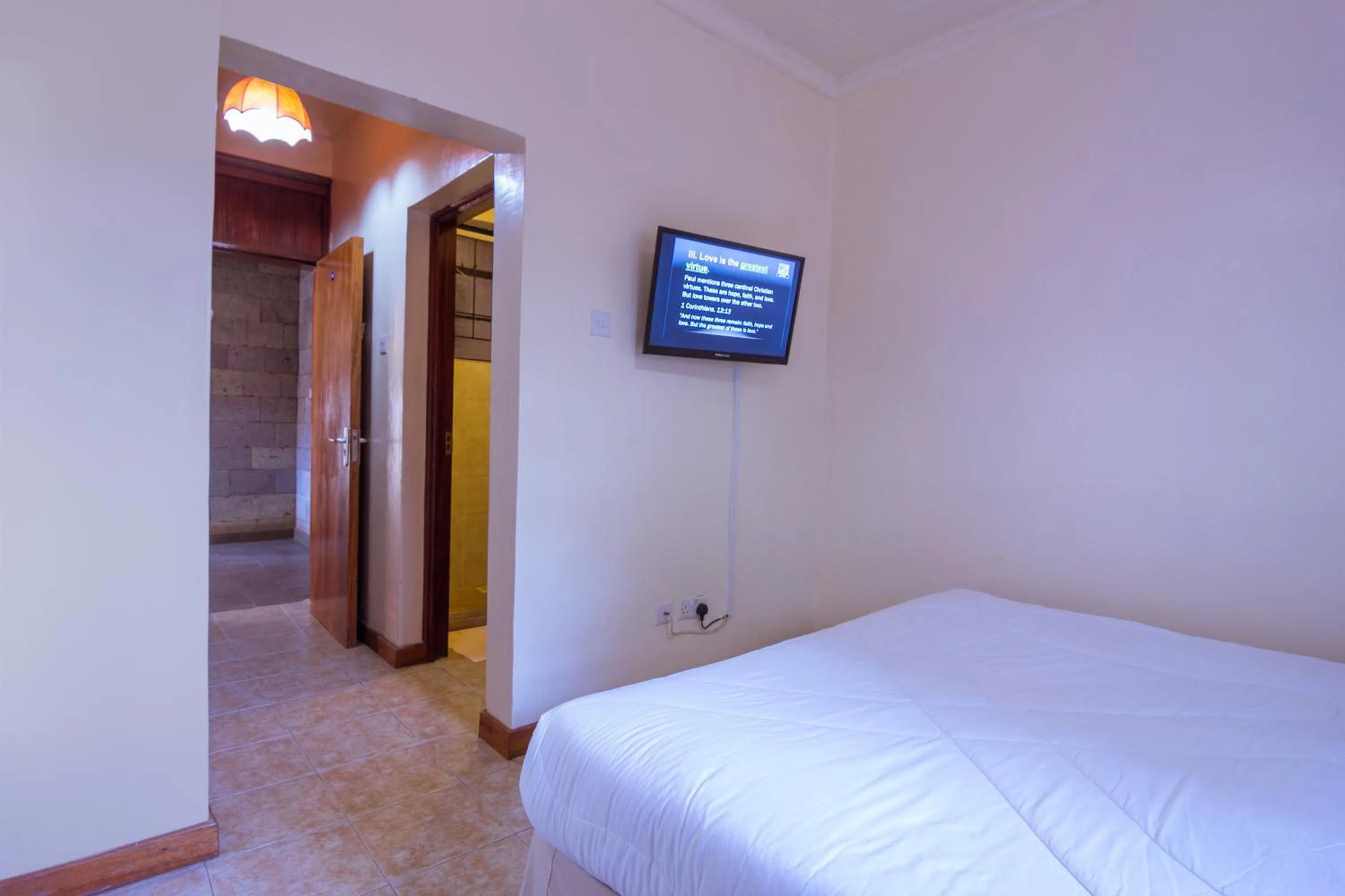 Shower, Bed in Chak Guesthouse & Conference Center