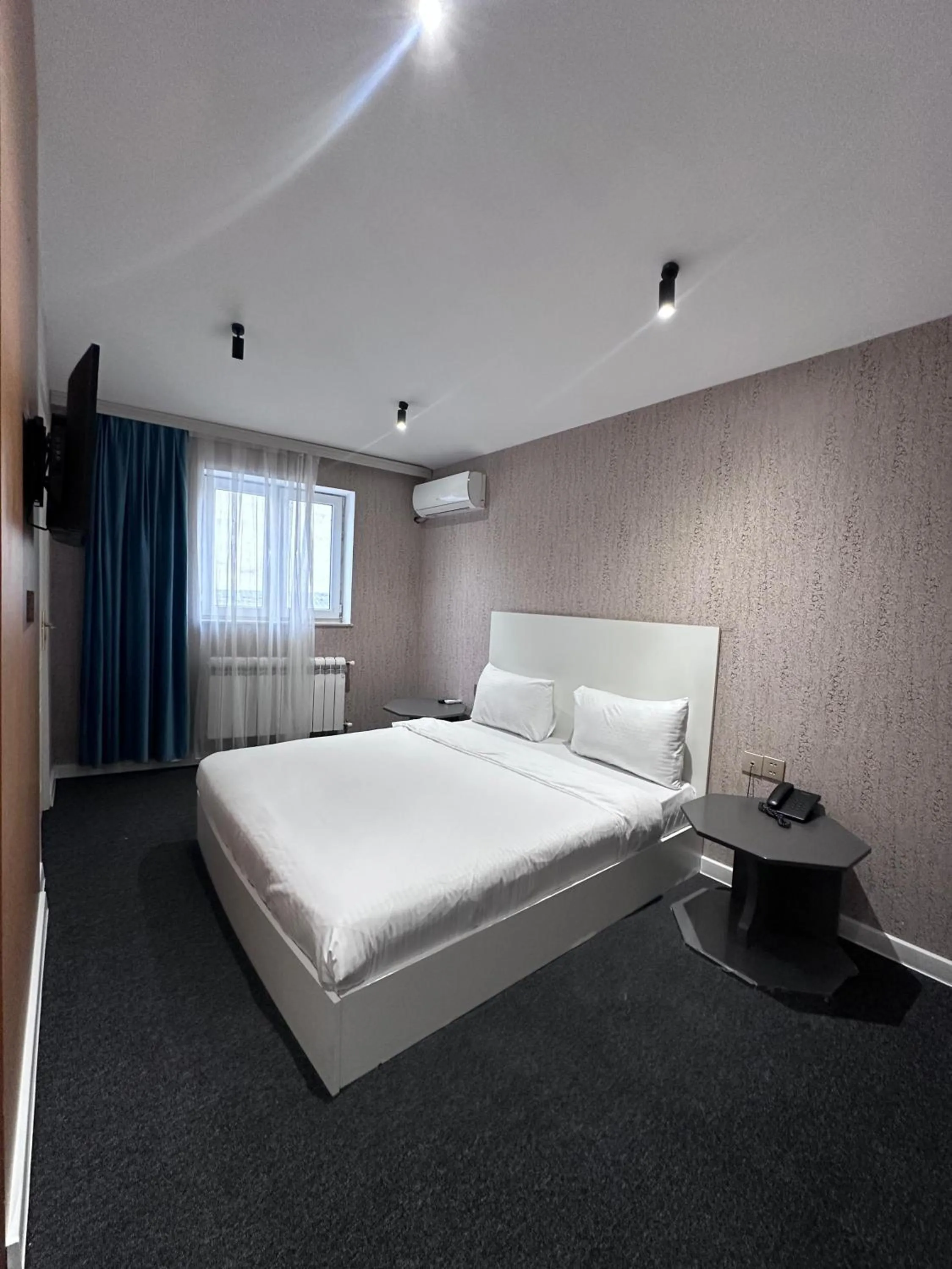 Bed in Central City Hotel