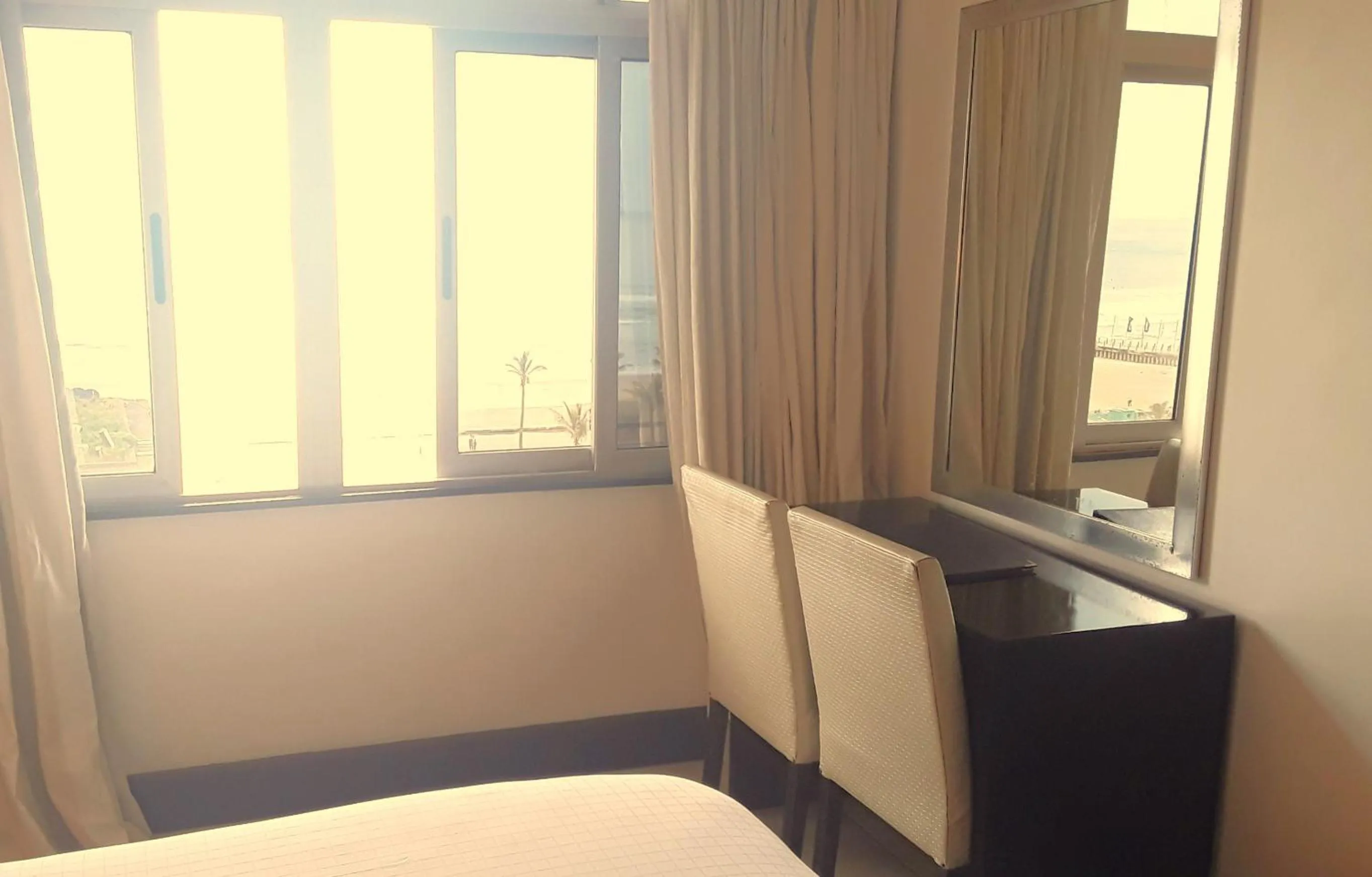 Seating area, Bed in Parade Hotel