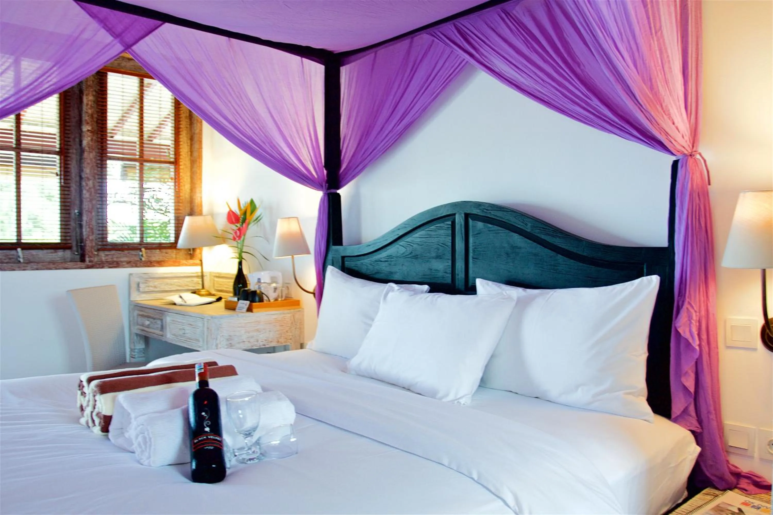 Bed in OK Divers Resort & Spa