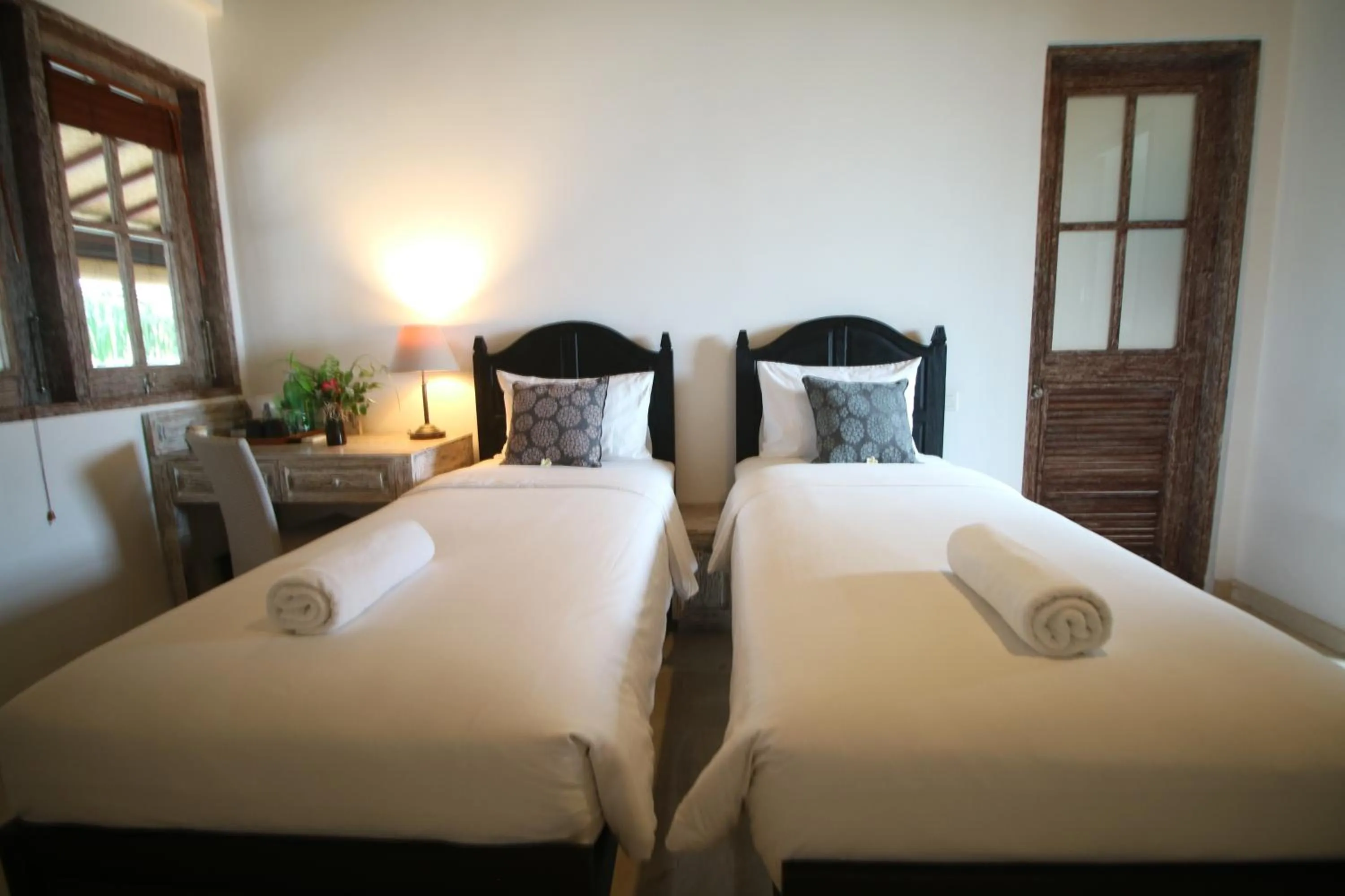 Bed in OK Divers Resort & Spa