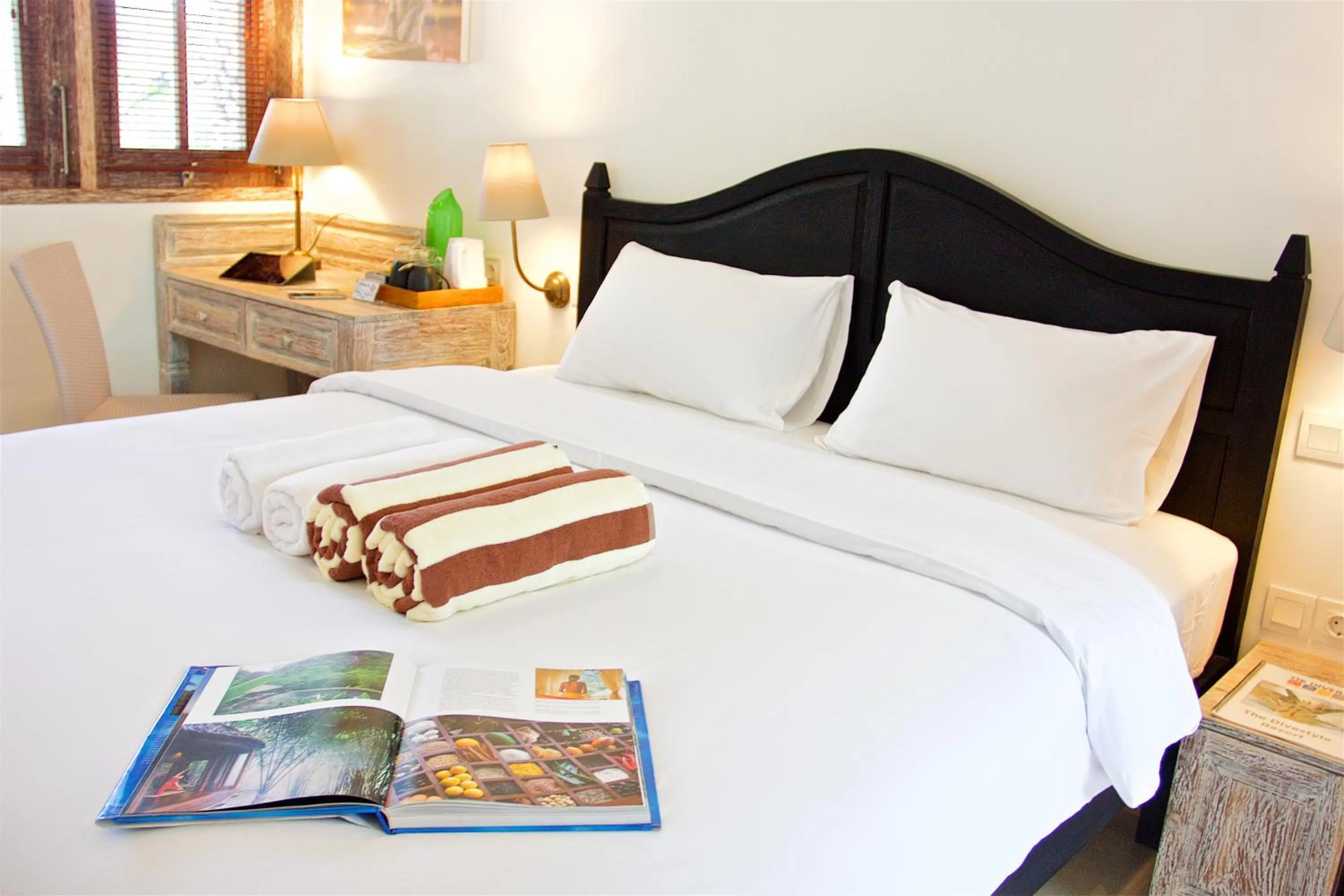 Bed in OK Divers Resort & Spa