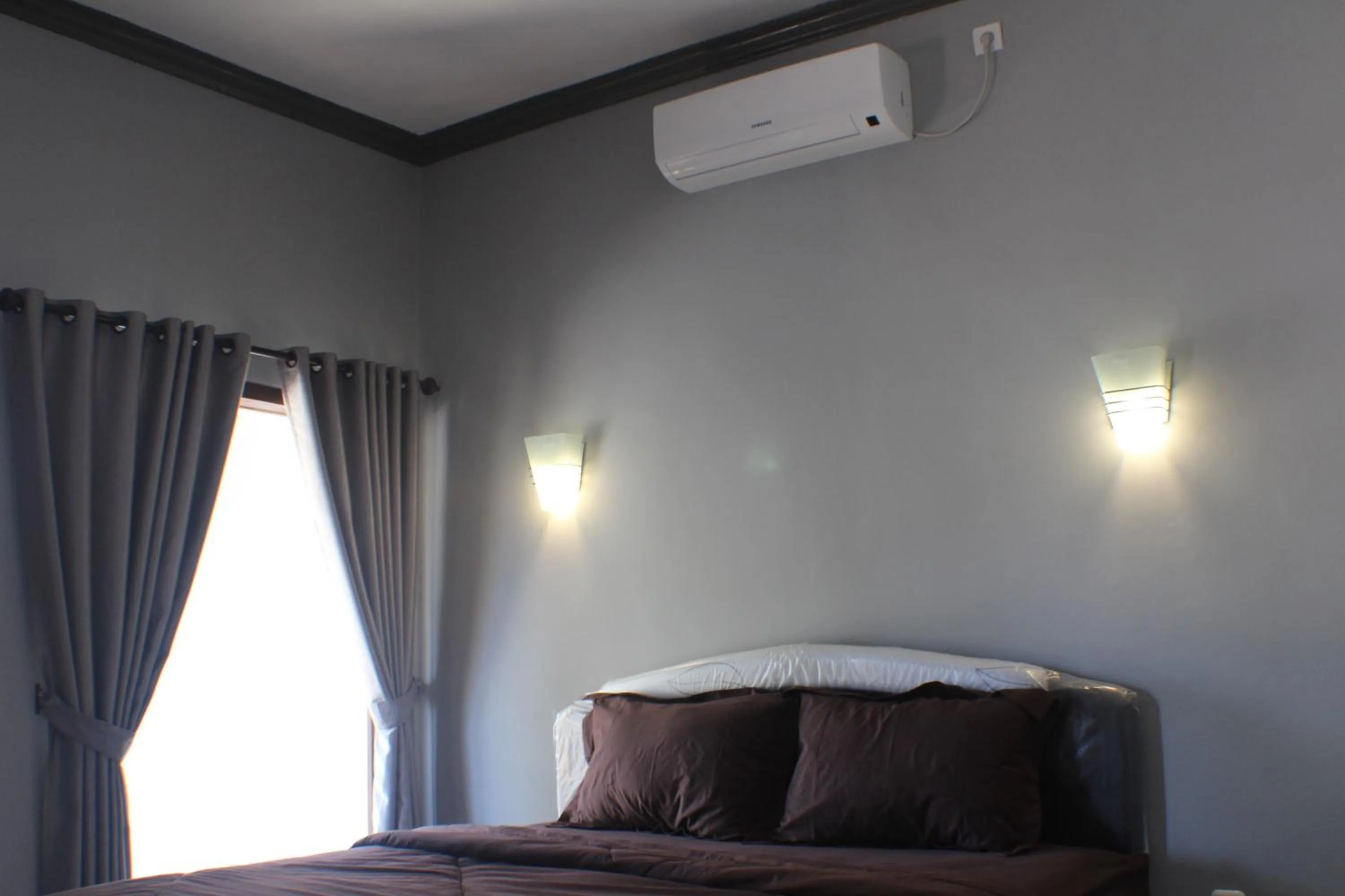 Decorative detail, Bed in Tri Putri Homestay