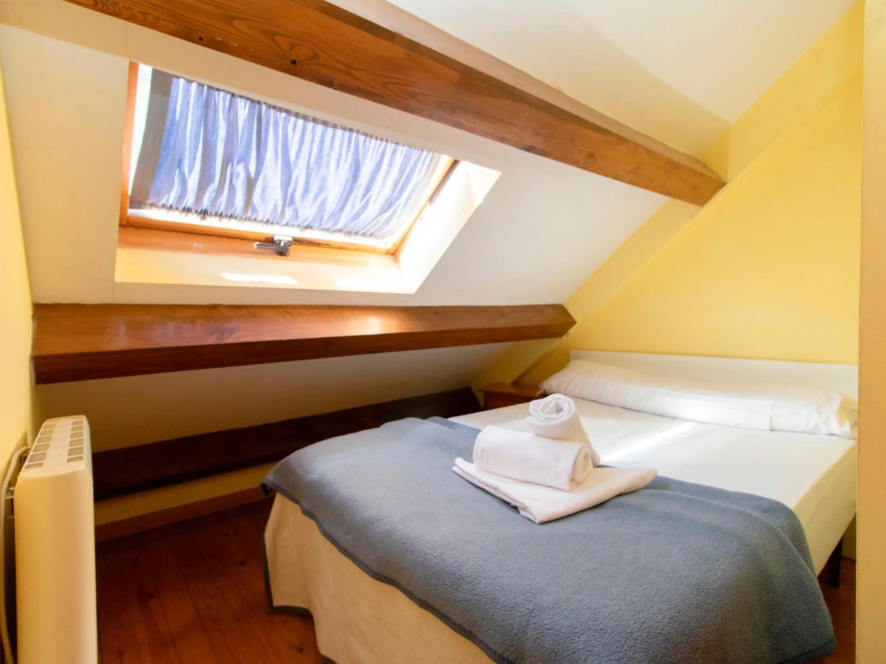 Bed in Apartamentos Canfranc 3000